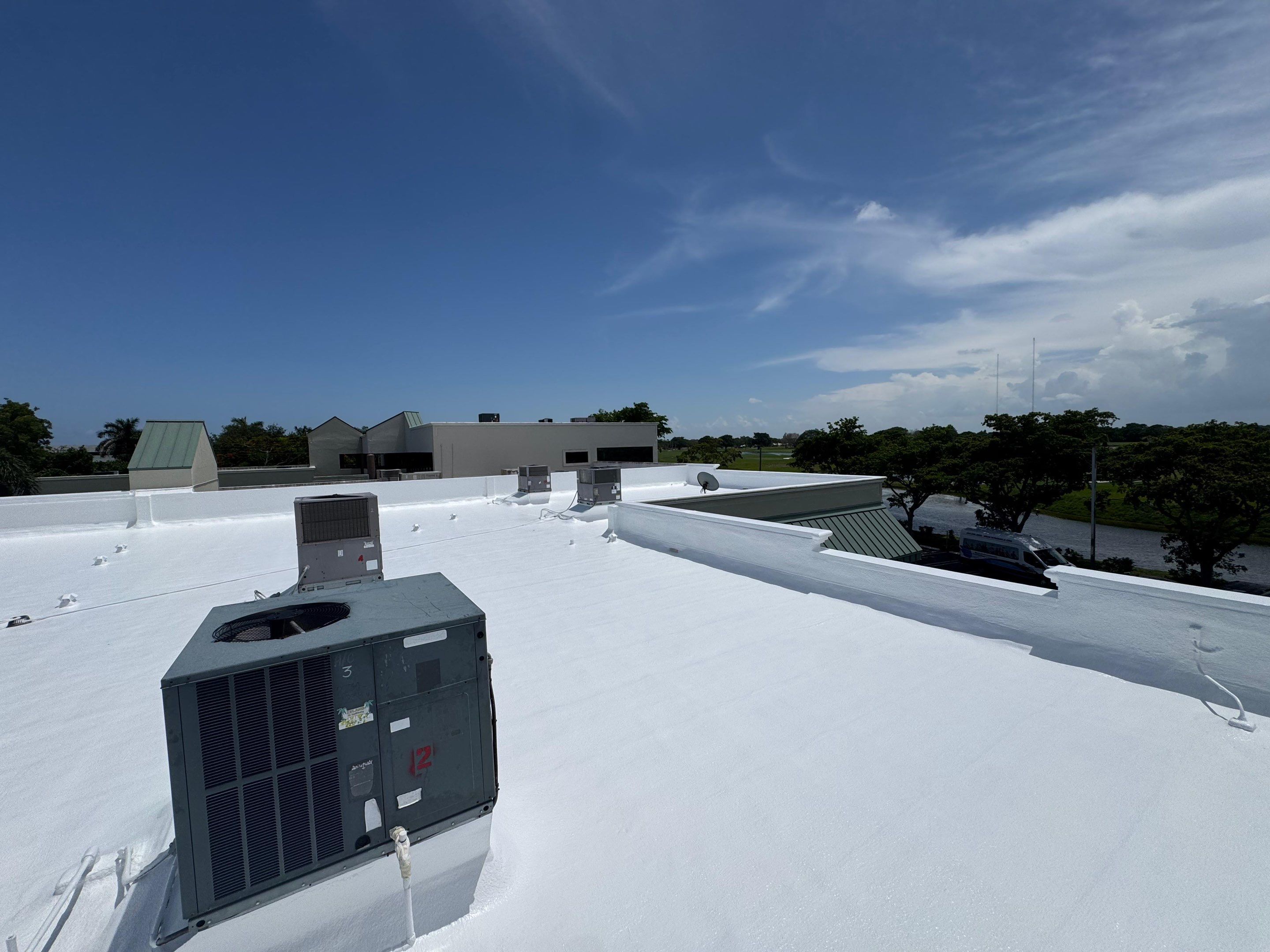 Commercial Flat Roof Restoration and Elastomeric Waterproofing in Delray Beach by Roof King LLC
