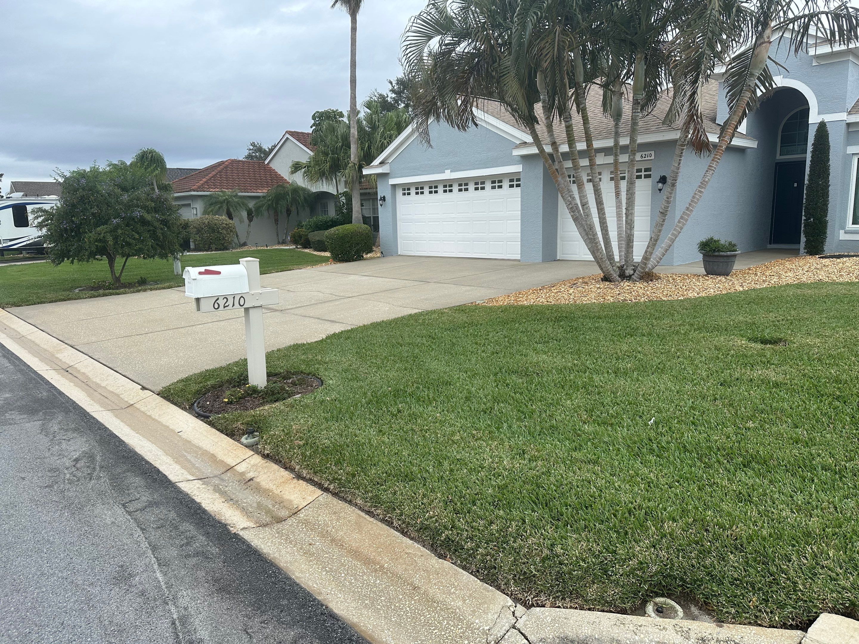 Concrete Driveway, Entryway & Street Curbing Cleaning in Fairways at Imperial Lakes, Palmetto, FL | Sunshine AquaWash by Sunshine AquaWash