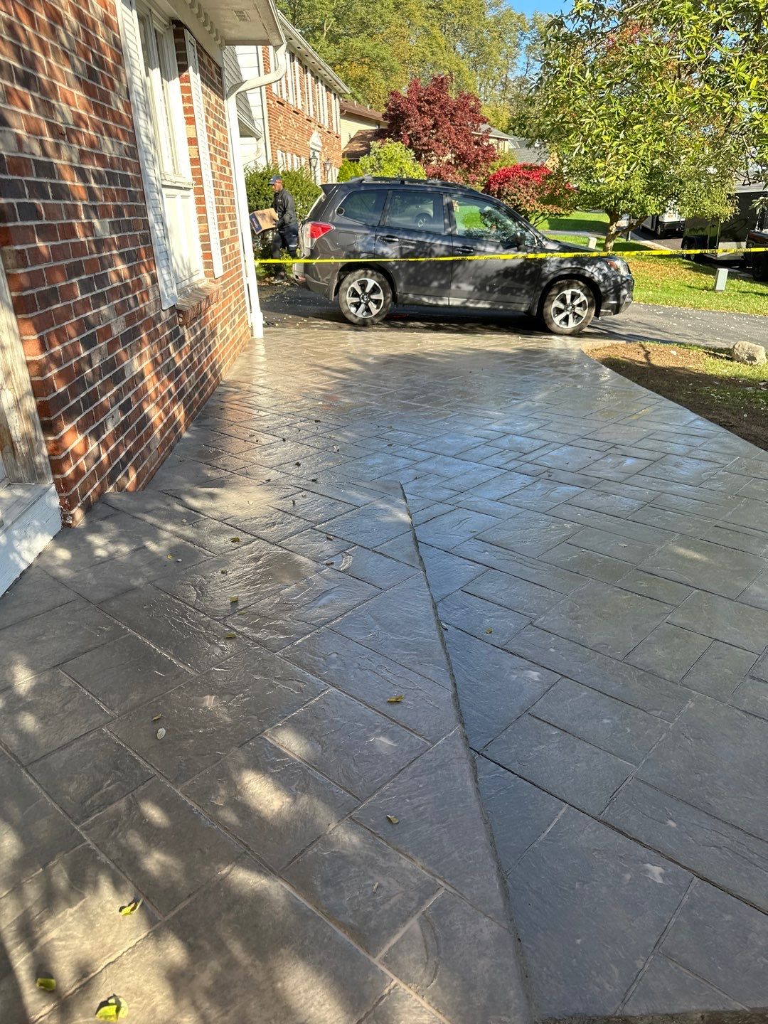 Ashlar slate stamped concrete patio  by NG Masonry & Construction LLC