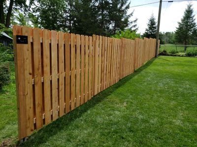 Unstained Cedar Wood Privacy Fence Installation in Cedar Falls