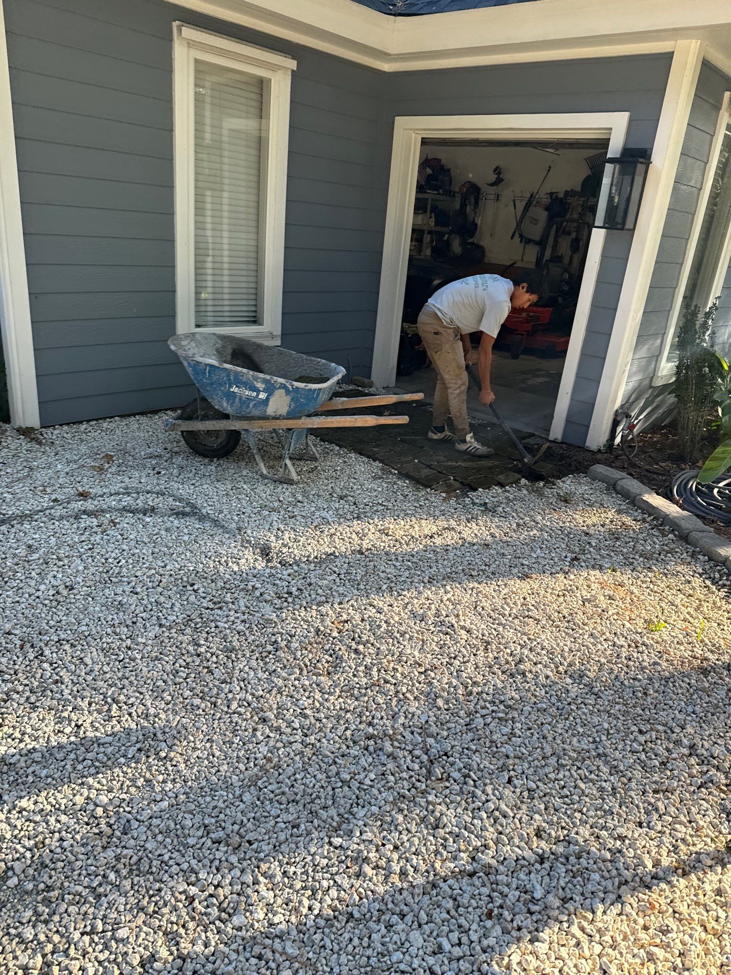 Concrete Driveway and Patio Installation With Decorative Brick Borders by Lowcountry Scapes, LLC