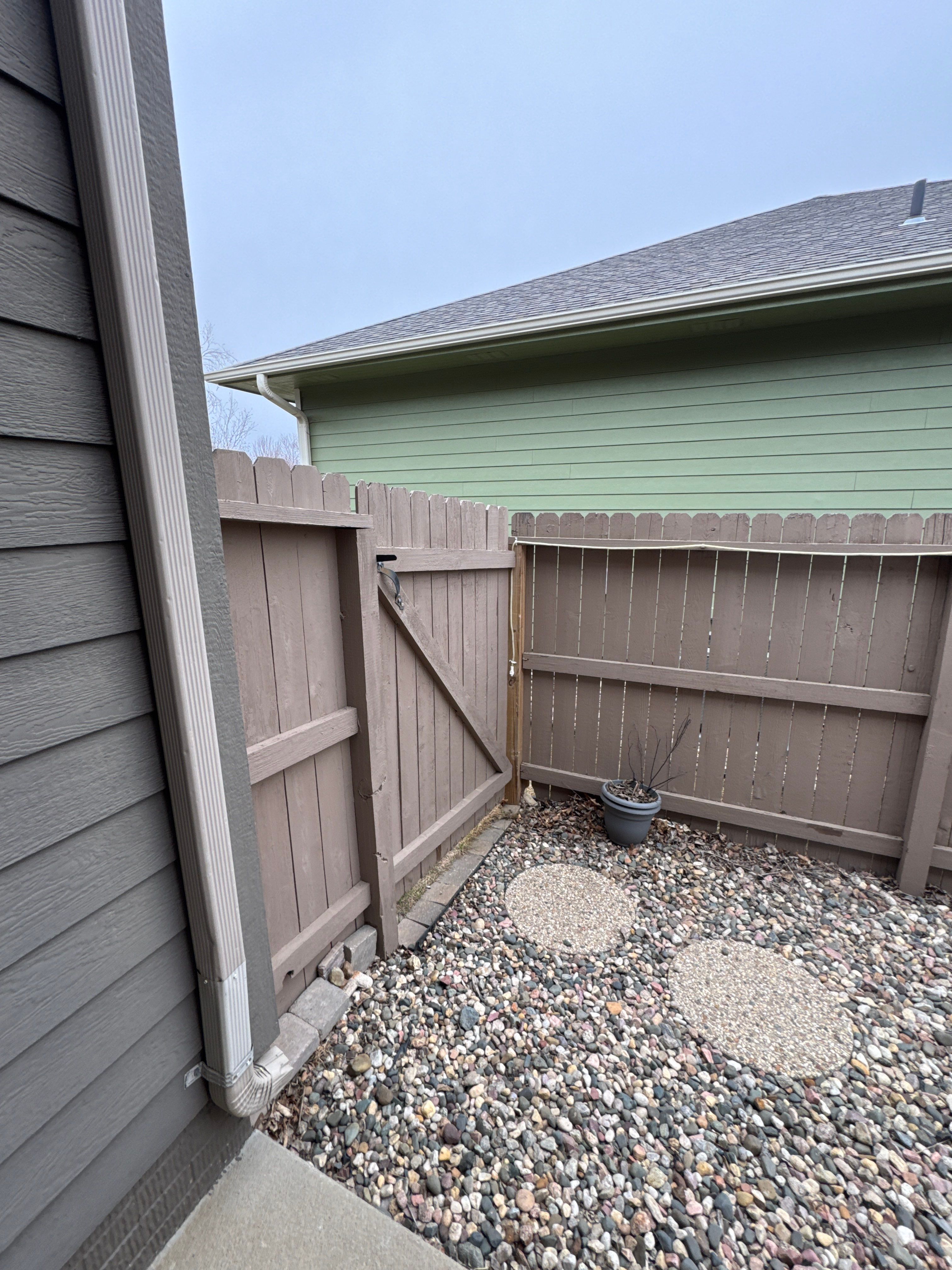 Sioux Falls Residential Exterior Update and Flagstone Pool Deck by Select Painting, Coatings & Garage Cabinets