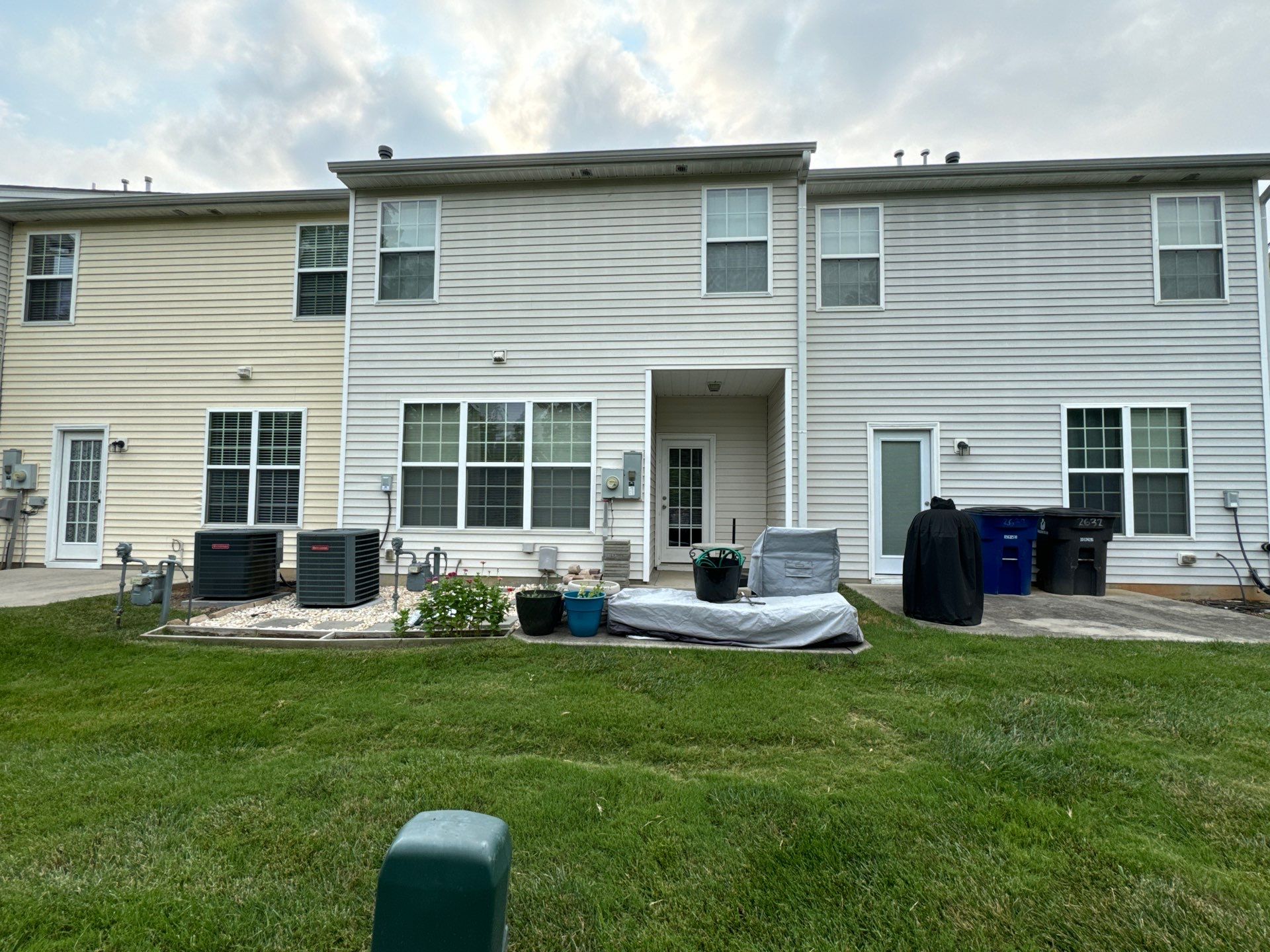 pressure washing exterior siding to remove dirt and maintain the appearance of the home