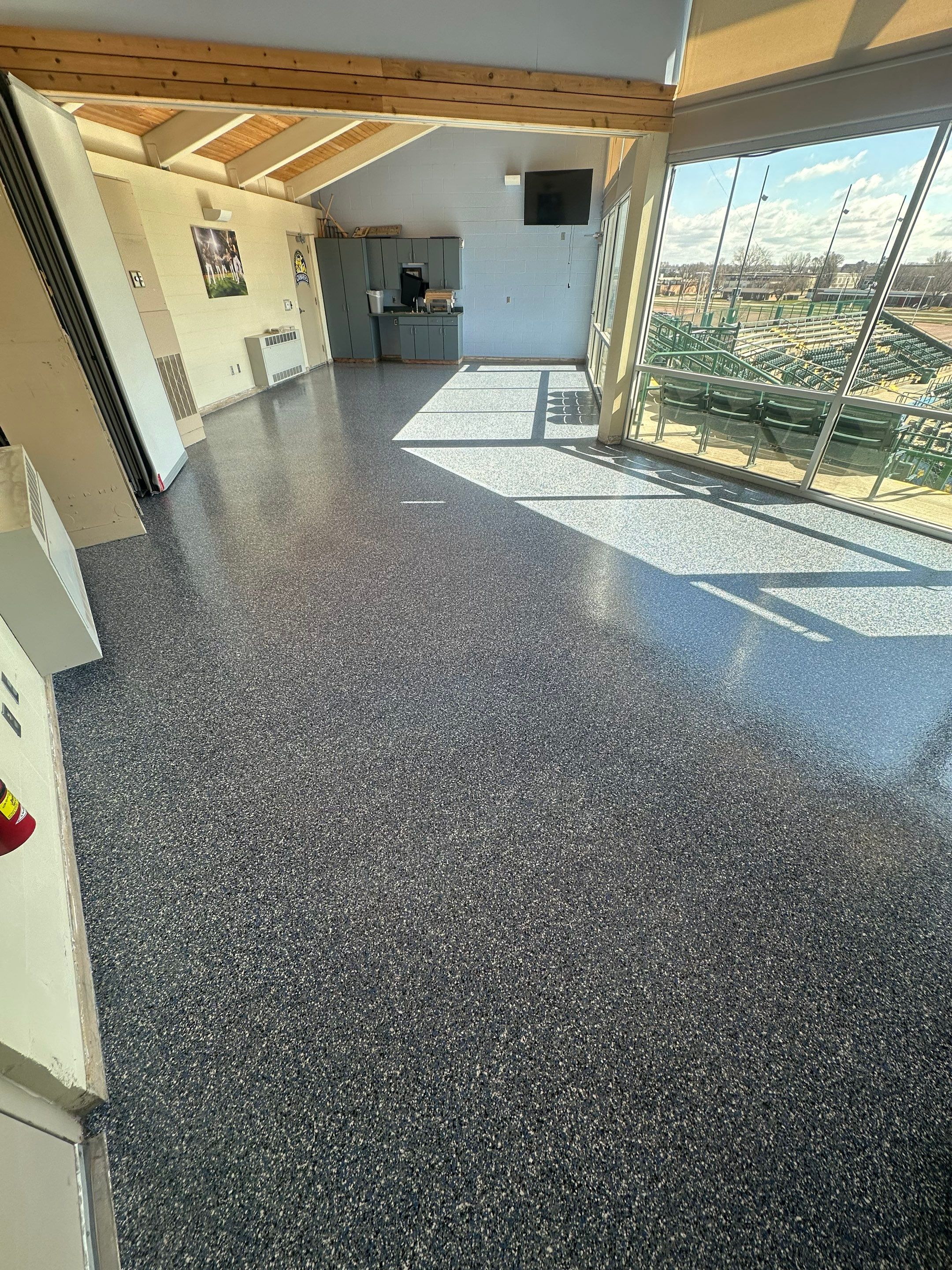 Commercial Epoxy Floor Coating for Stadium Viewing Suites in Sioux Falls by Select Painting, Coatings & Garage Cabinets