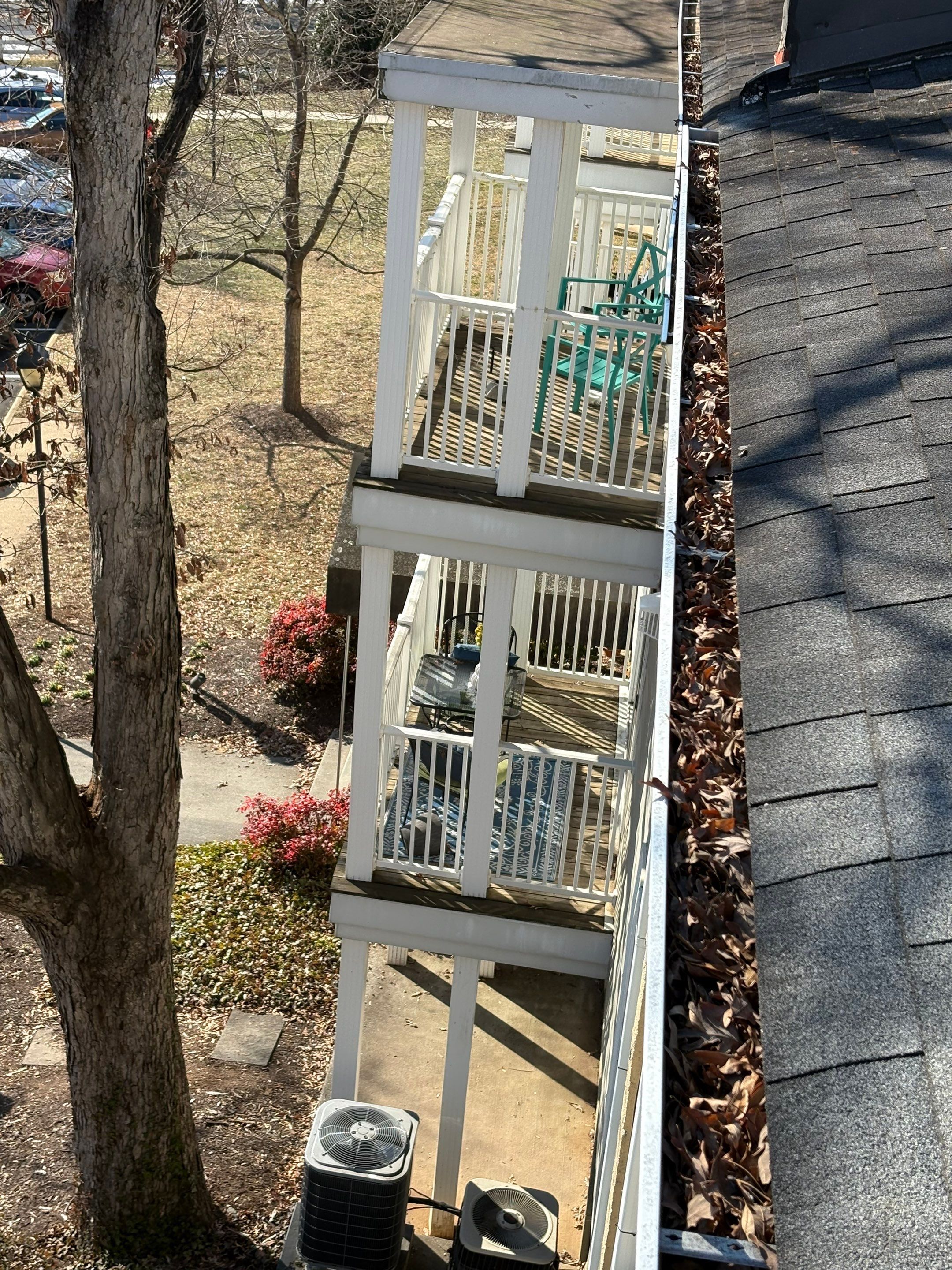 Commercial gutter cleaning Charlottesville before photo with filled gutters