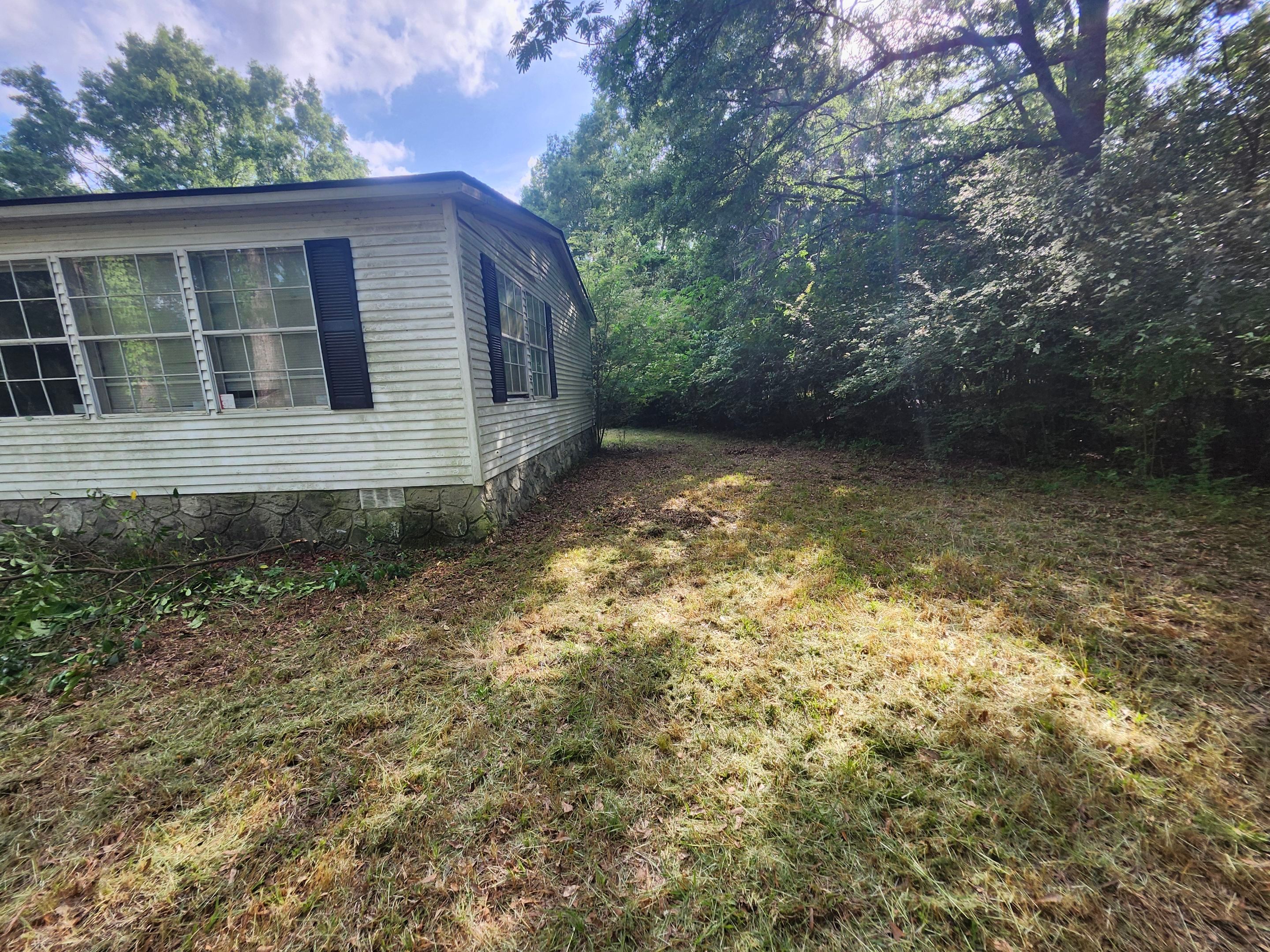 Exterior Clearing - tree trimming - grass cut by Swift Signings and Services LLC