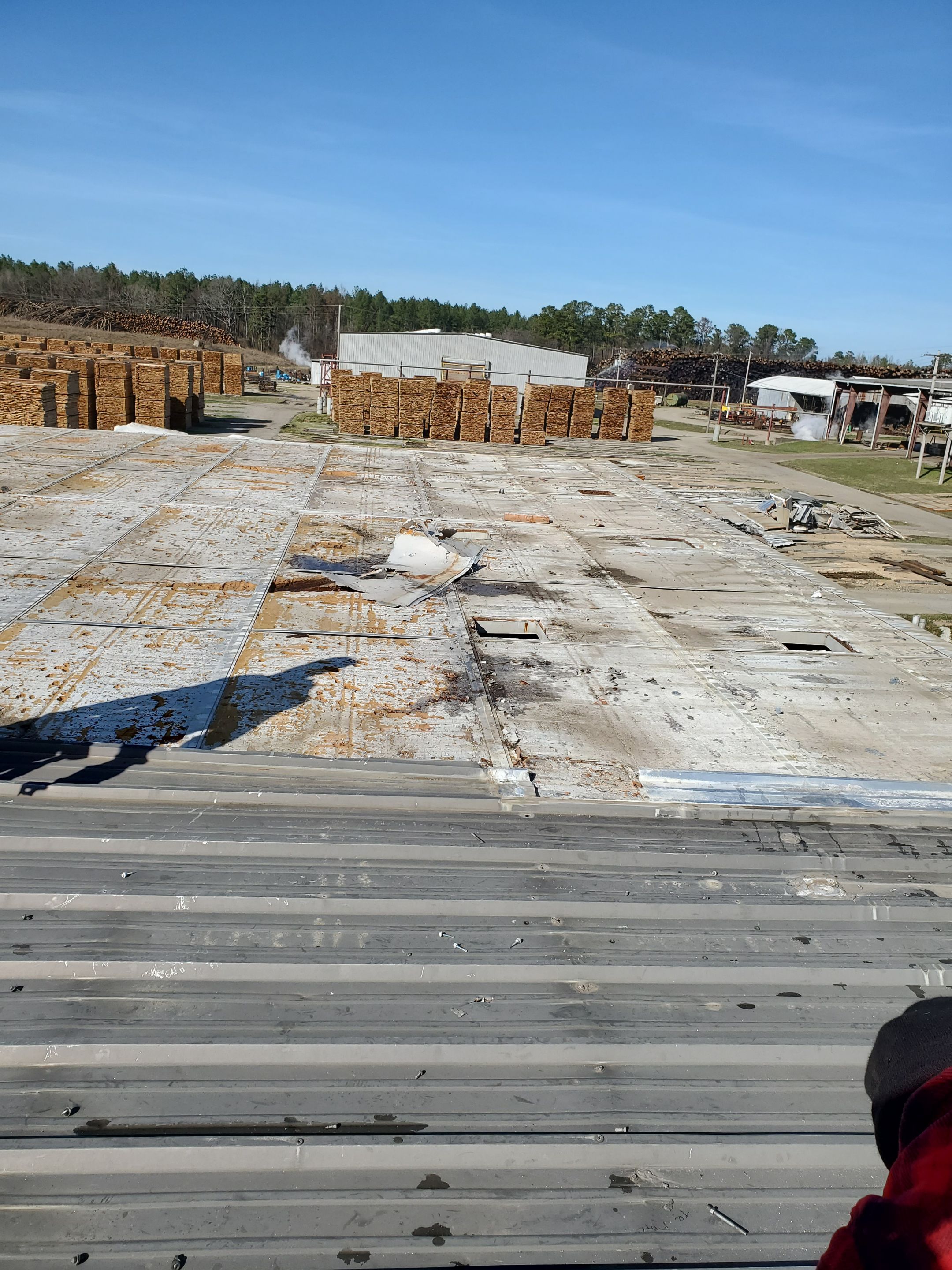 Commercial Roofing Installation using Aluminum Roofing panels by Hostetler Roofing