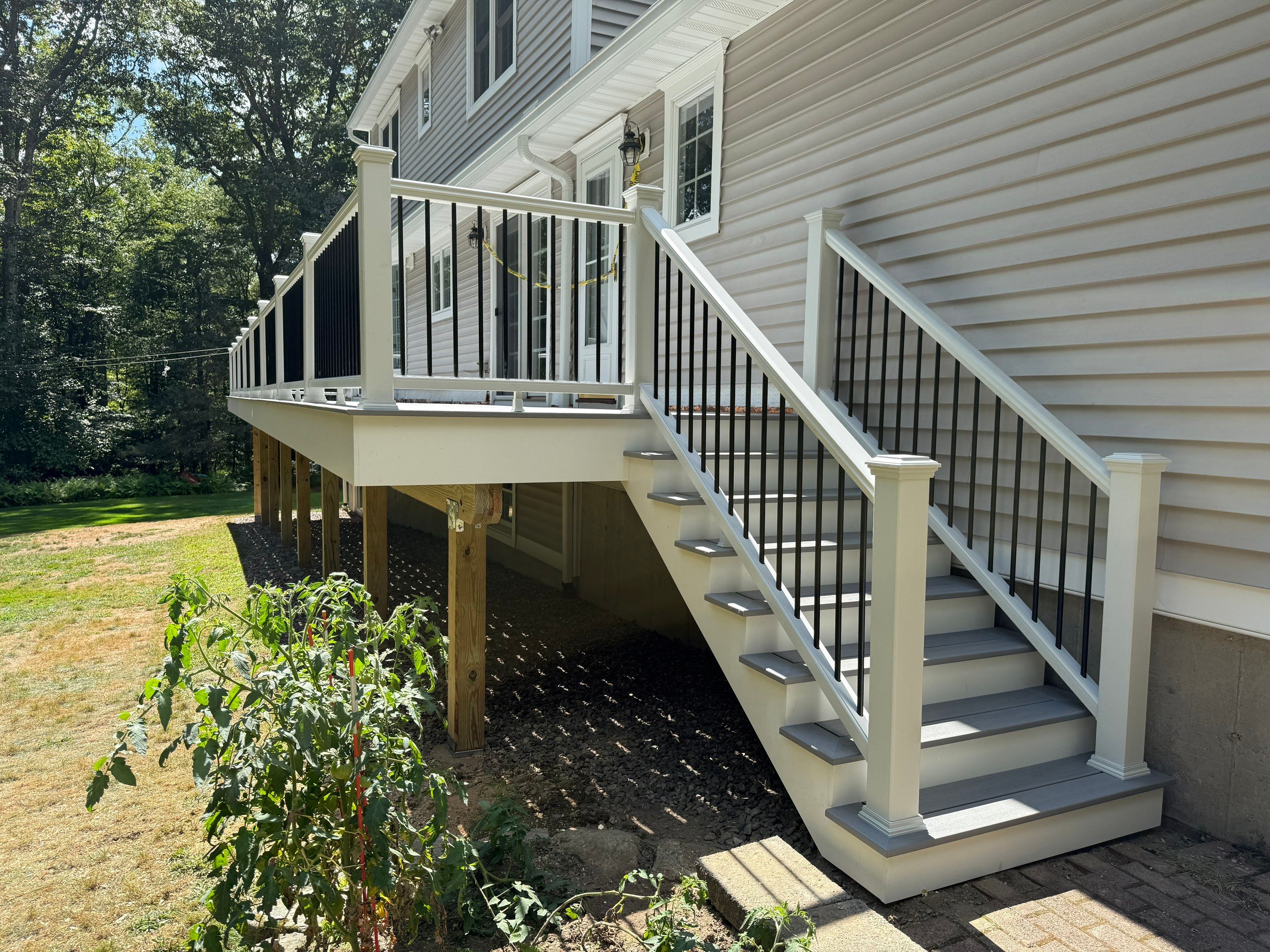 Replacement of front and back decks using Trex Lineage Island mist and Trex Lineage Rainier by DiGiorgi Roofing and Siding Inc