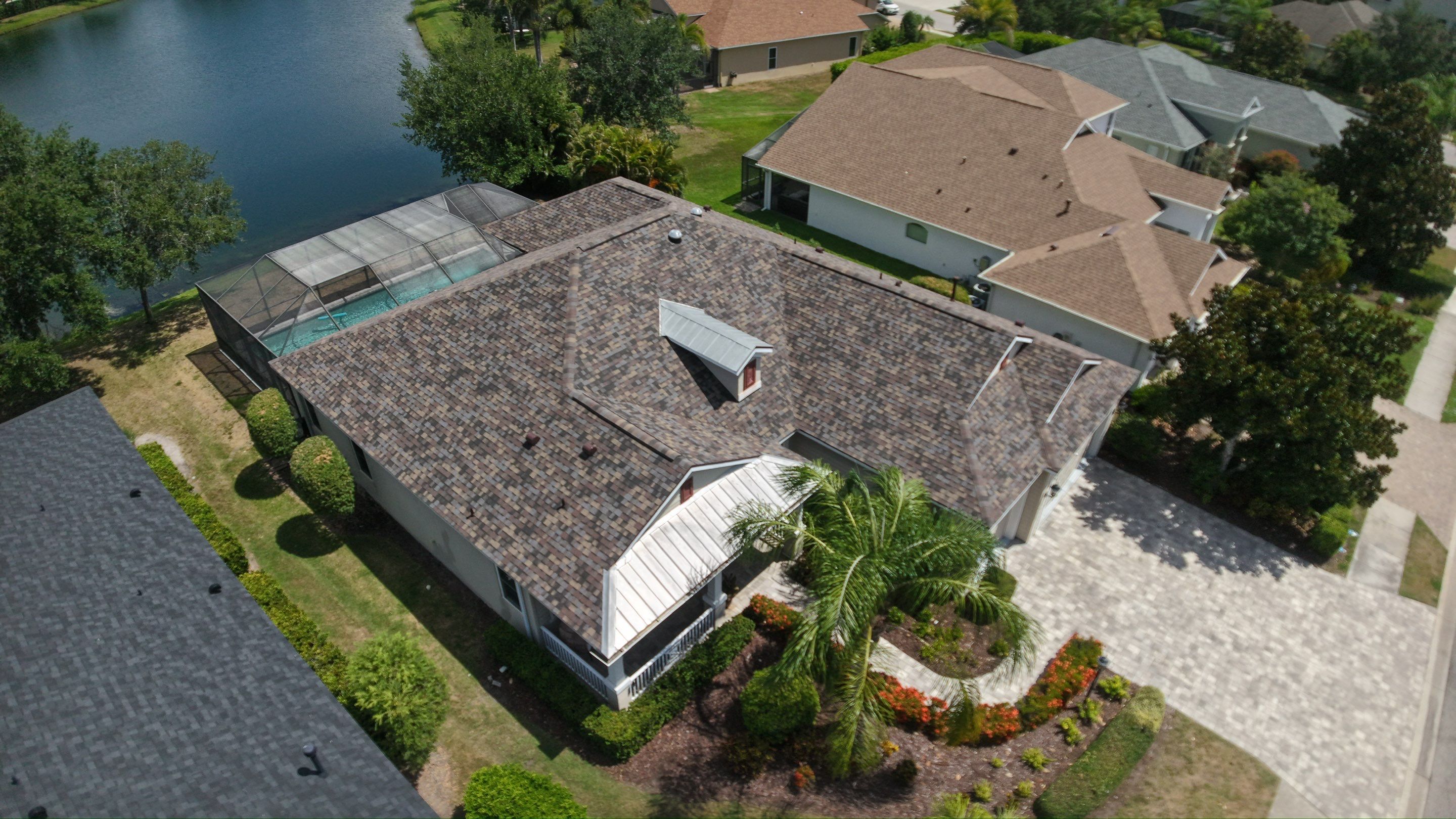 Architectural Summer Harvest Asphalt Shingle Roof Replacement in Bradenton, Florida by Trinity Restoration and Roofing LLC