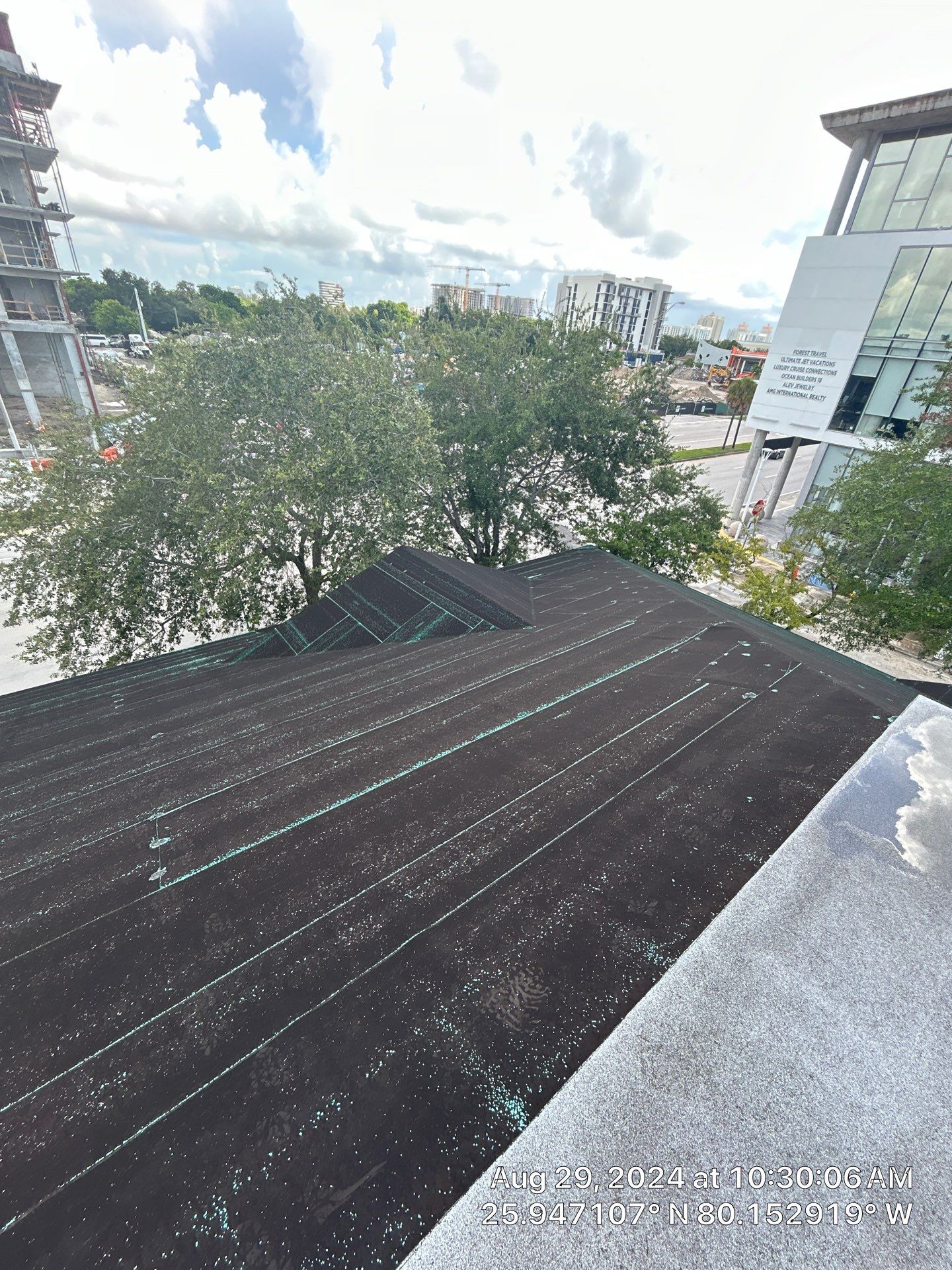 COMMERCIAL REROOF 24 GUAGE MEDIUM BRONZE 1-1/2" MECHANICAL SEAM "ZEBRA METHOD" by Earl W. Johnston Roofing 