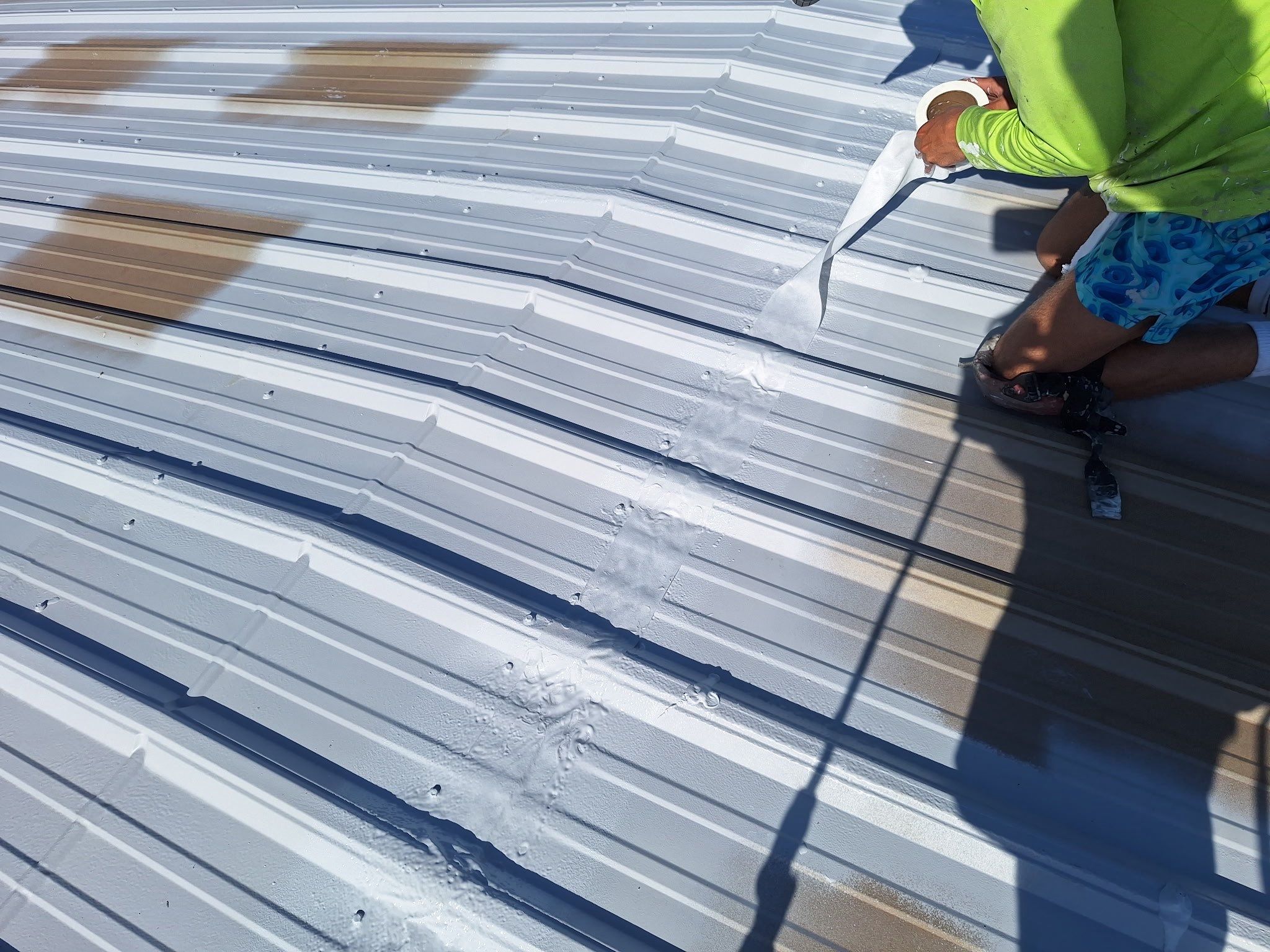 Commercial Metal Roof Restoration with White Protective Coating by Southern Roof Solutions