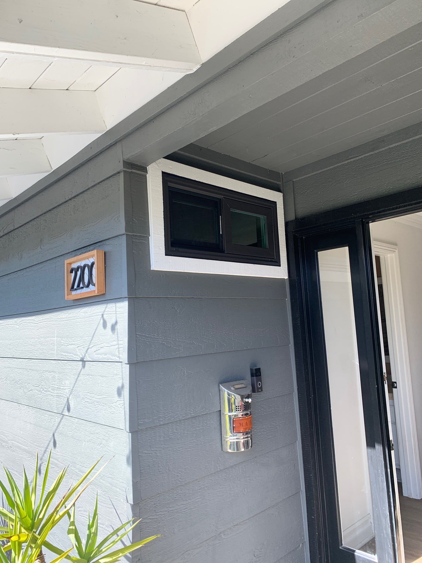 Window Installation using Milgard black vinyl windows by American Window Company