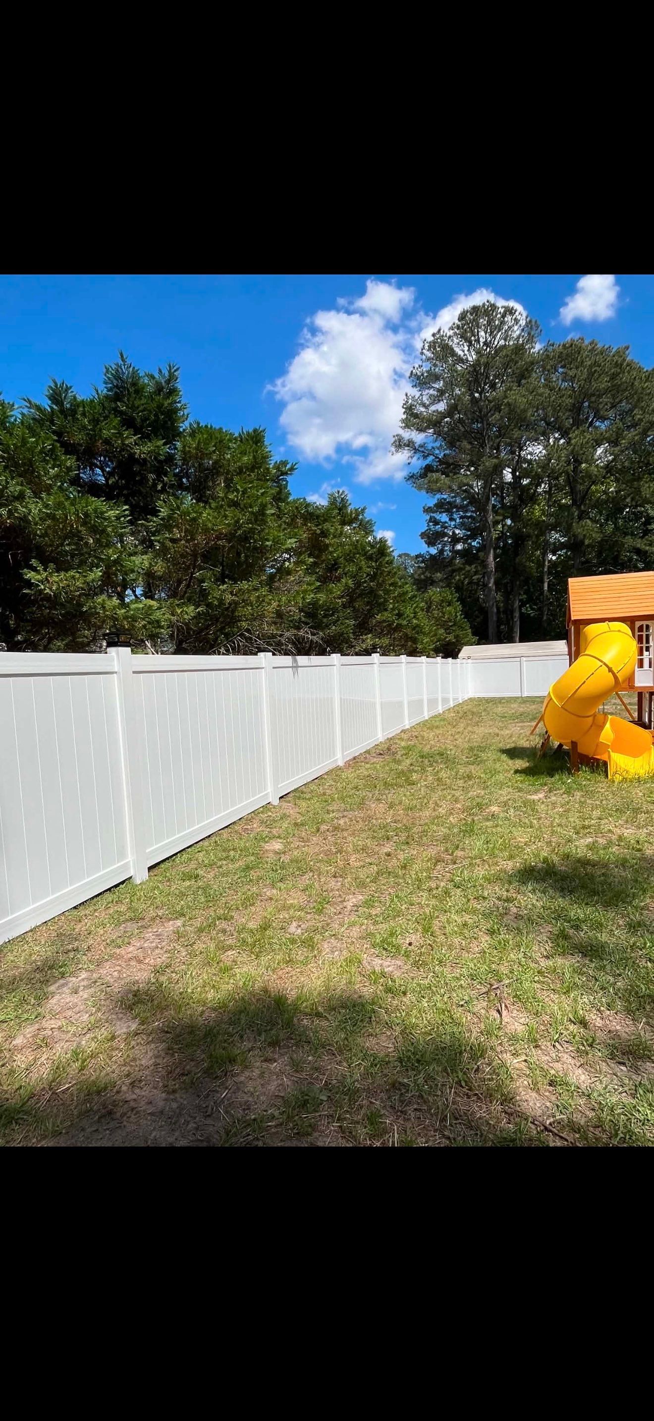 White Vinyl Privacy Fence with Solar Post Caps in Goldsboro by Superior Fence and Rail