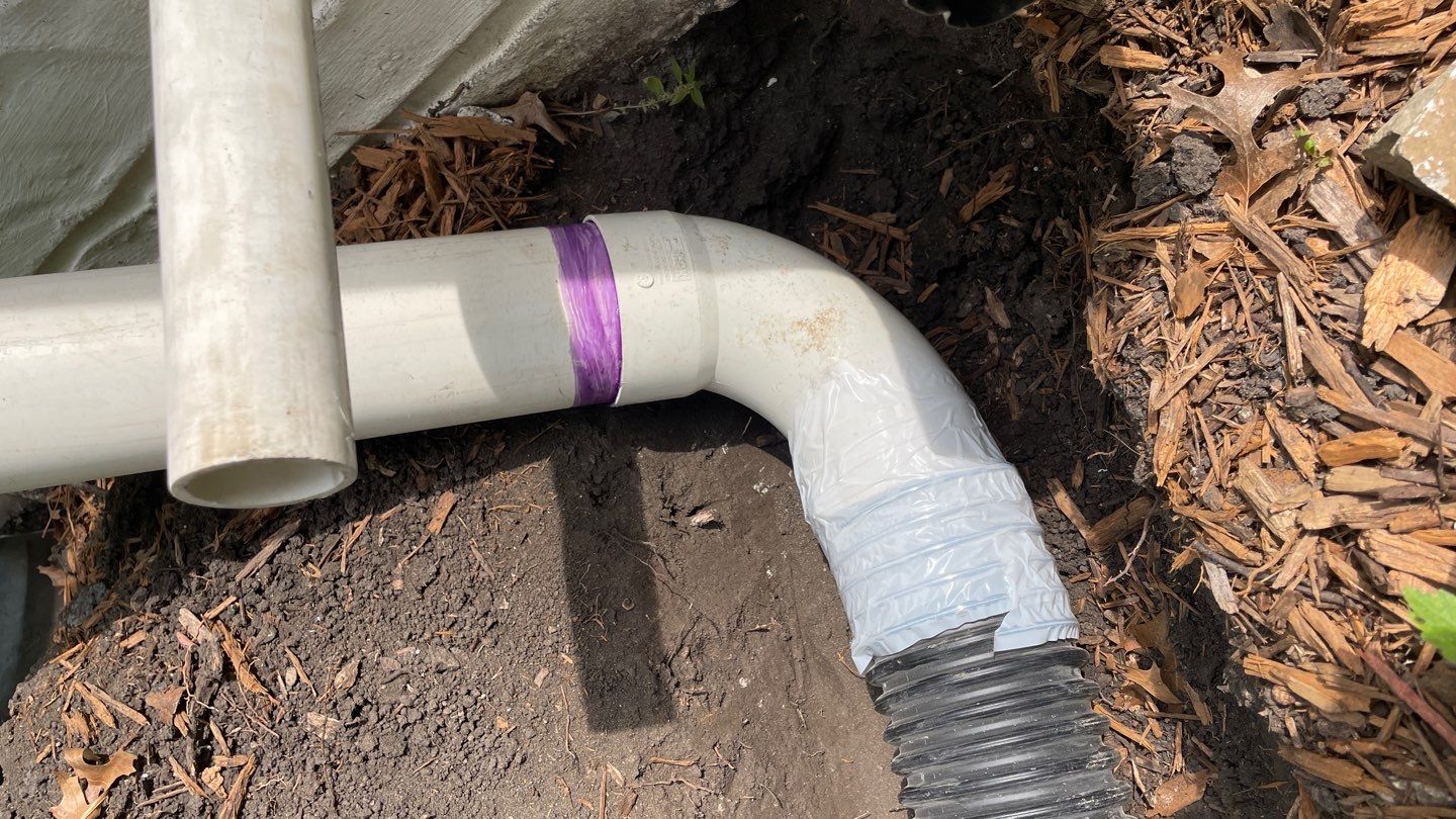 Drain Tile, Window Wells & Buried Discharge in Minneapolis by Waterproofing Northeast