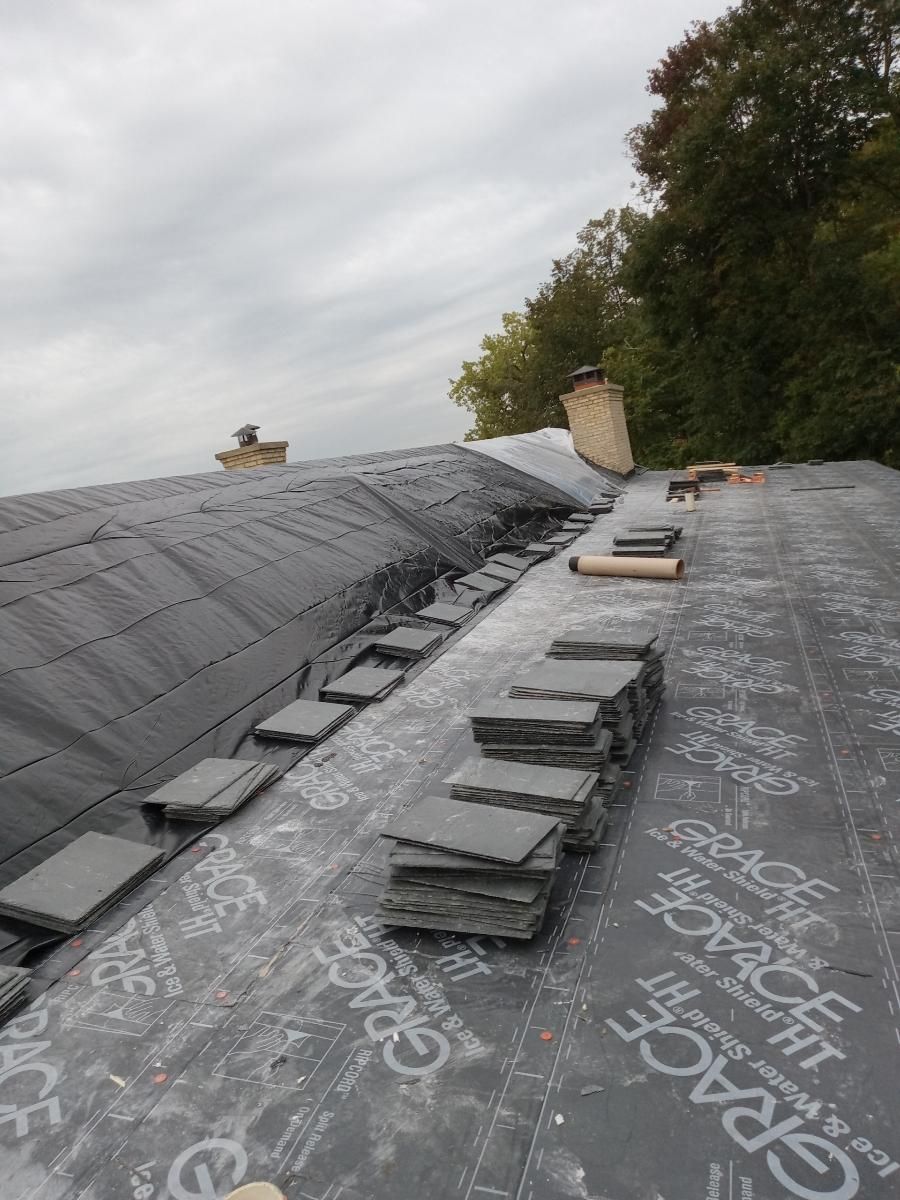 Slate Roof Replacement and Half Round Copper Gutter Installation by Custom Installations