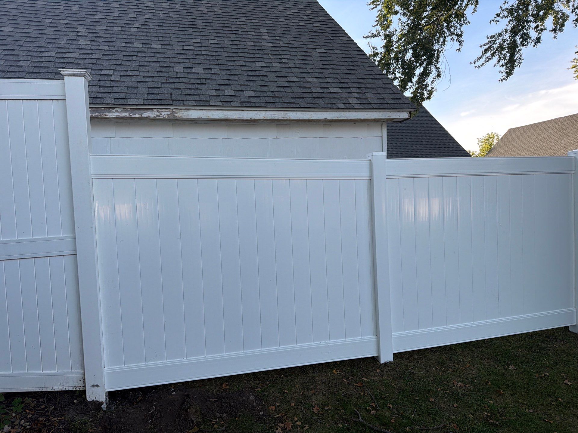 White Vinyl Privacy Fence and Gate Installation in Grundy Center by Perfect Picket Fence and Stain