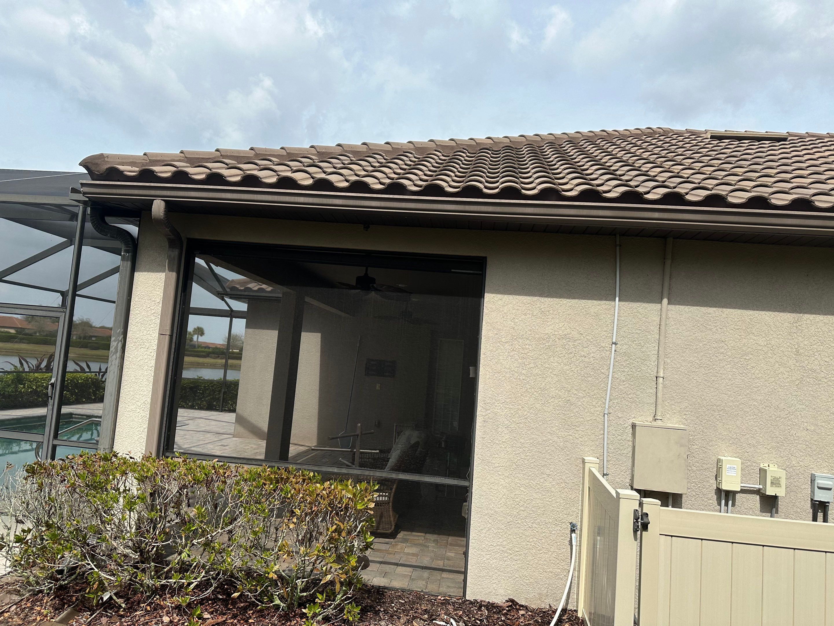 Concrete Tile Roof, Paver Pool Deck, Screen Enclosure & Driveway Cleaning in Artisan Lakes Esplanade, Palmetto, FL | Sunshine AquaWash by Sunshine AquaWash