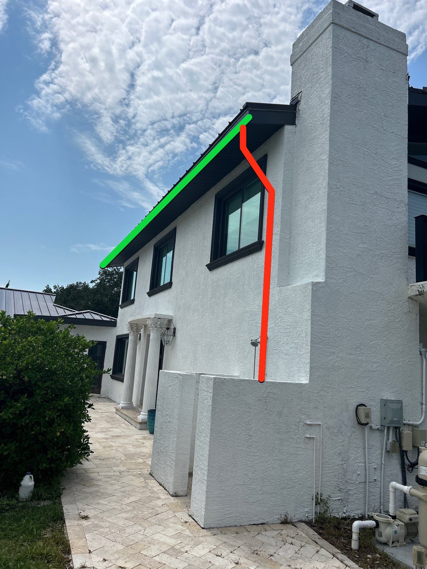 Black Seamless Gutters and Downspouts in Siesta Key FL by Gutter Professors