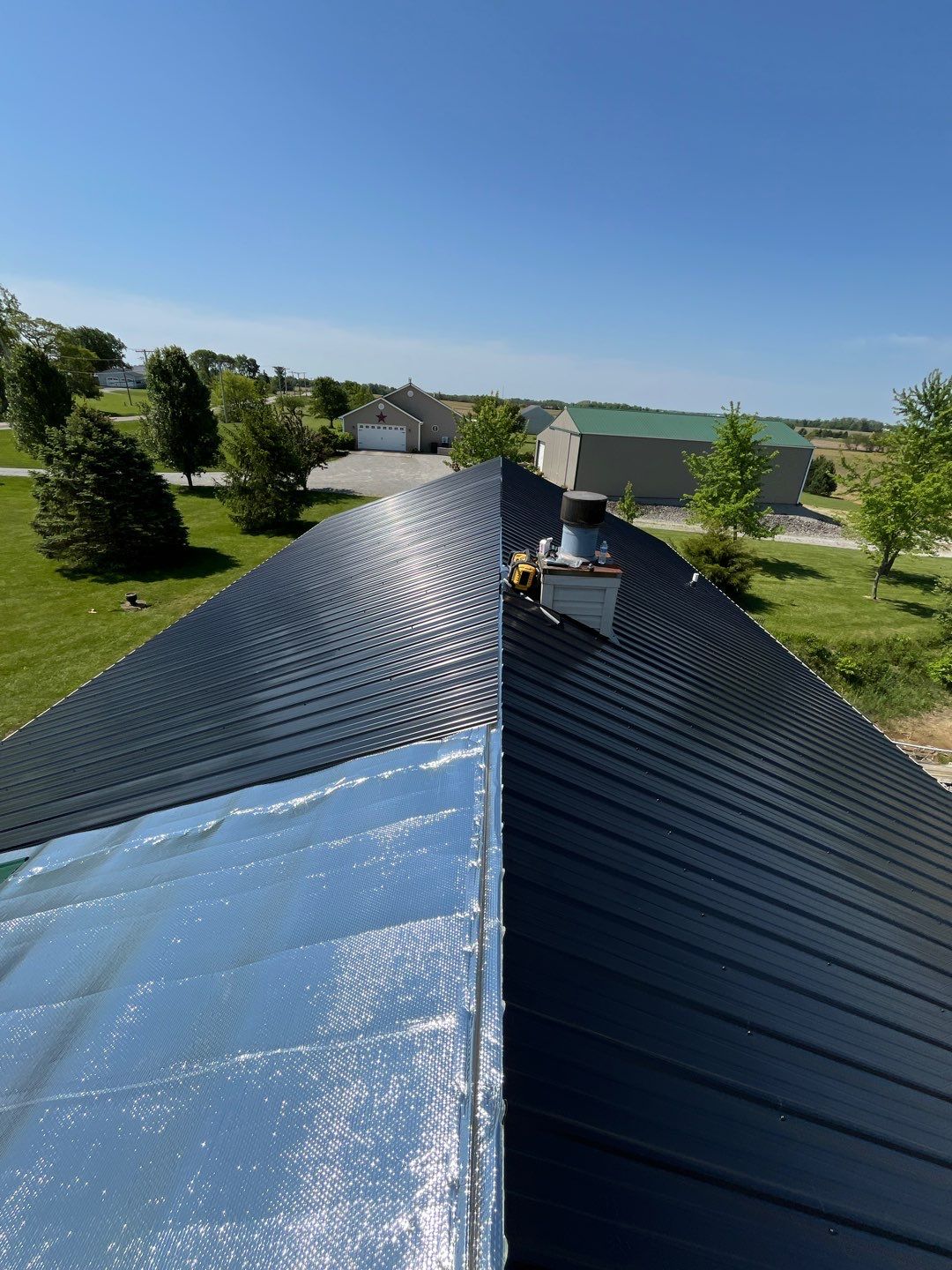 Residential Roofing Installation using Perfromance Panel Metal - Black by RoofX 