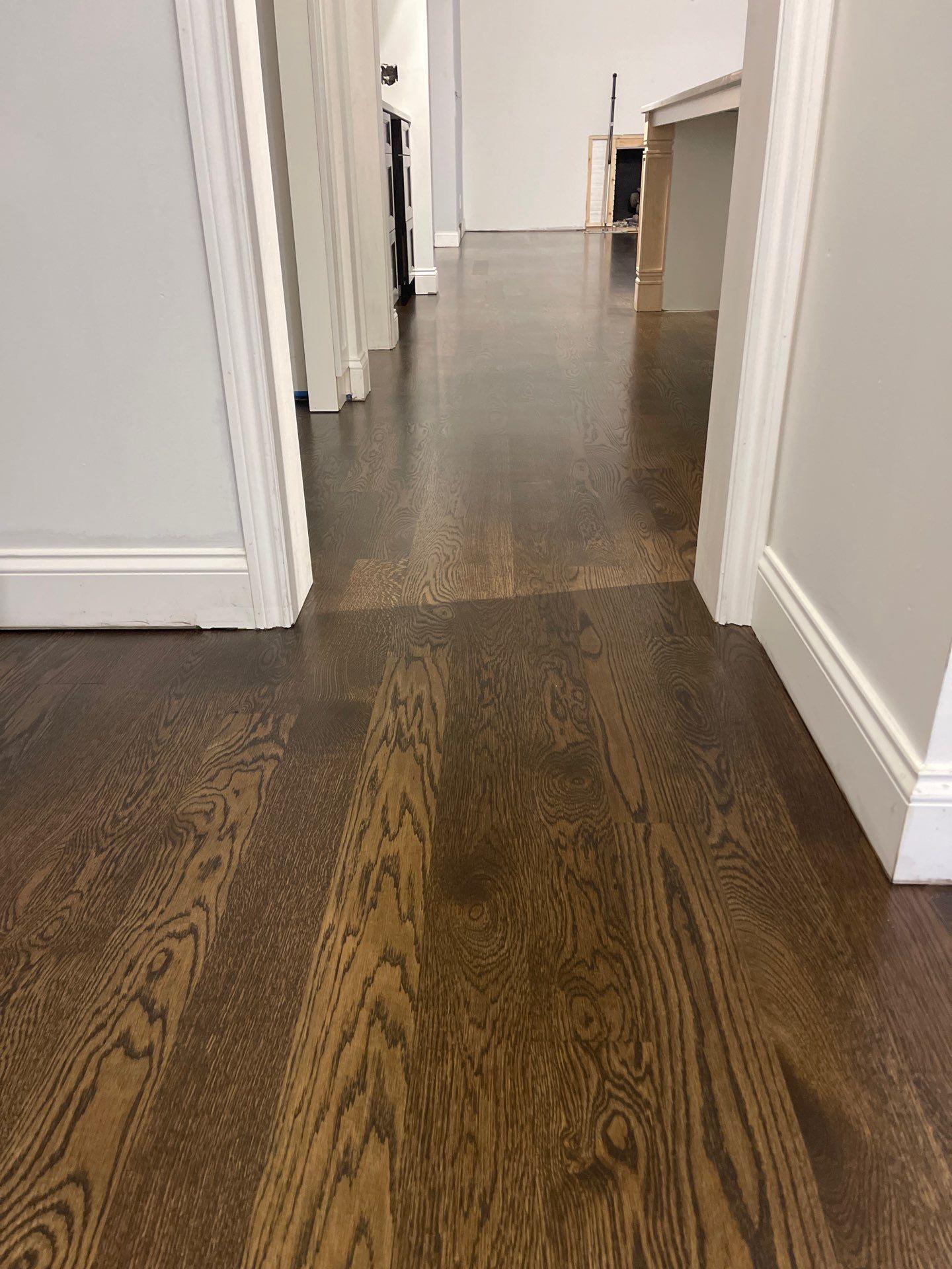 New Flooring installation using 4" White oak select grade plain sawn Ebony Stain by Ann Arbor Hardwoods