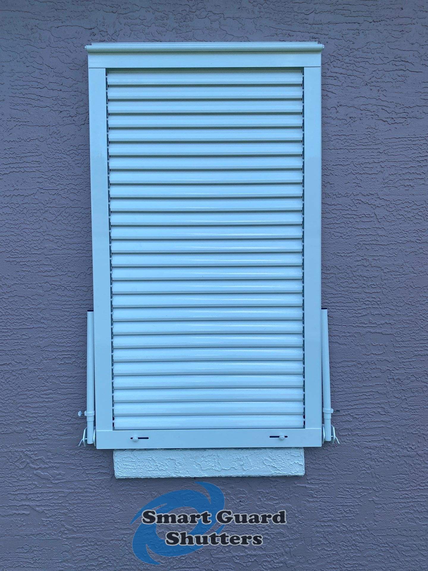 Impact Bahama Shutters in Signal White by Smart Guard Shutters