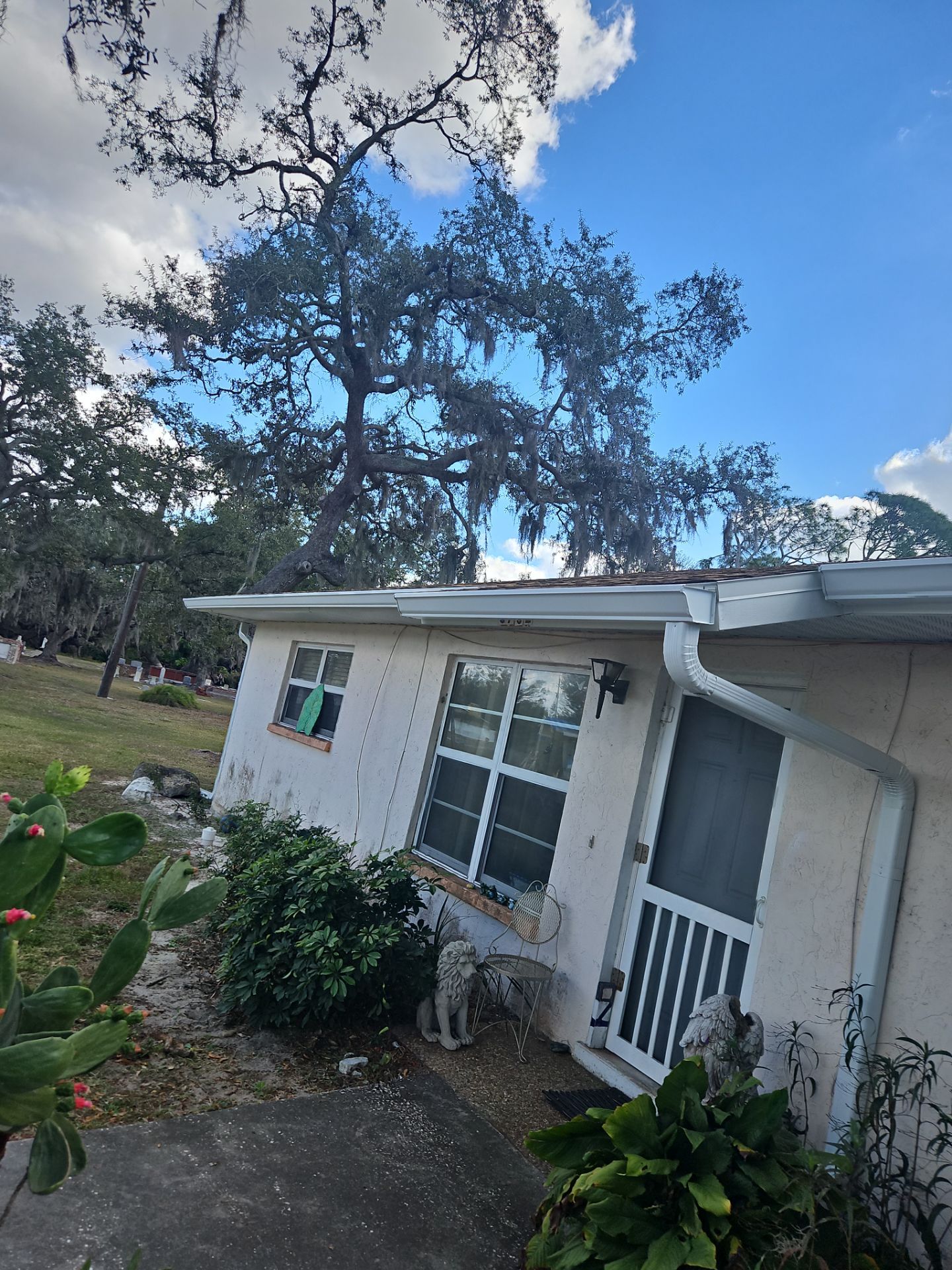 Downspout Installation using White Down Spouts in Sarasota FL by Gutter Professors