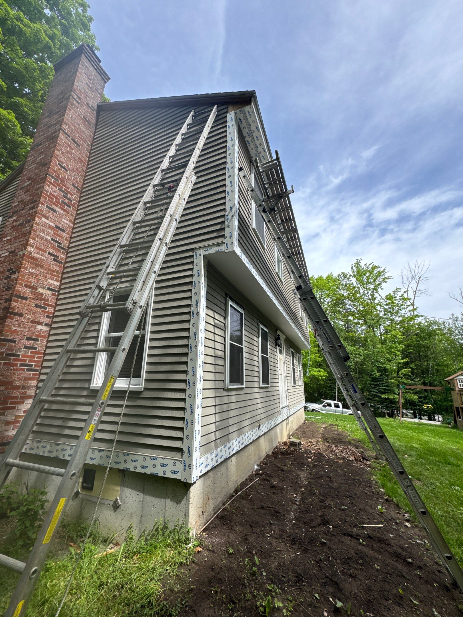 Vinyl Siding and AZEK PVC Trim Renovation in Weare by Compass exteriors