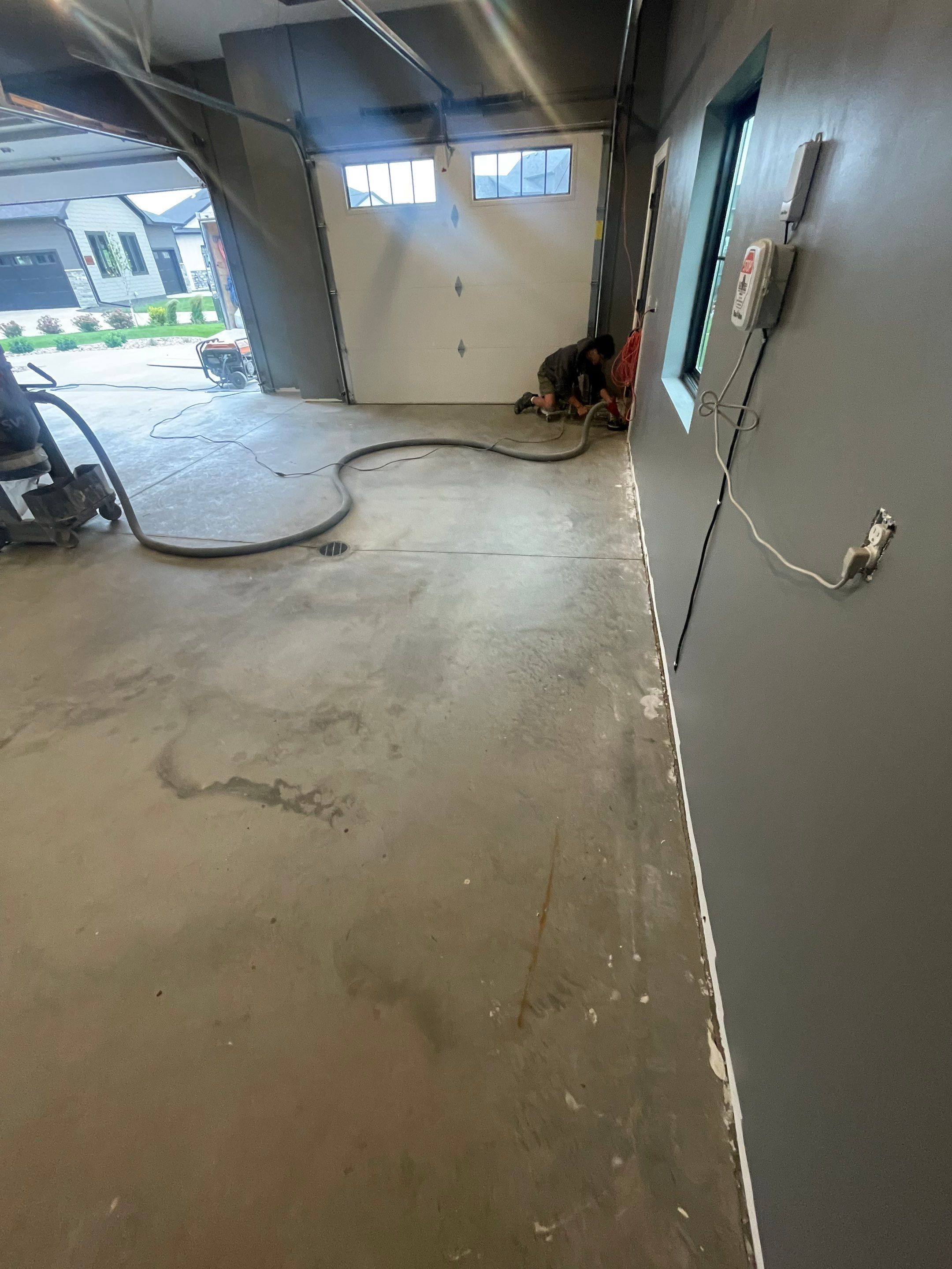 Custom Speckled Concrete Coating for Dell Rapids Garage by Select Painting, Coatings & Garage Cabinets
