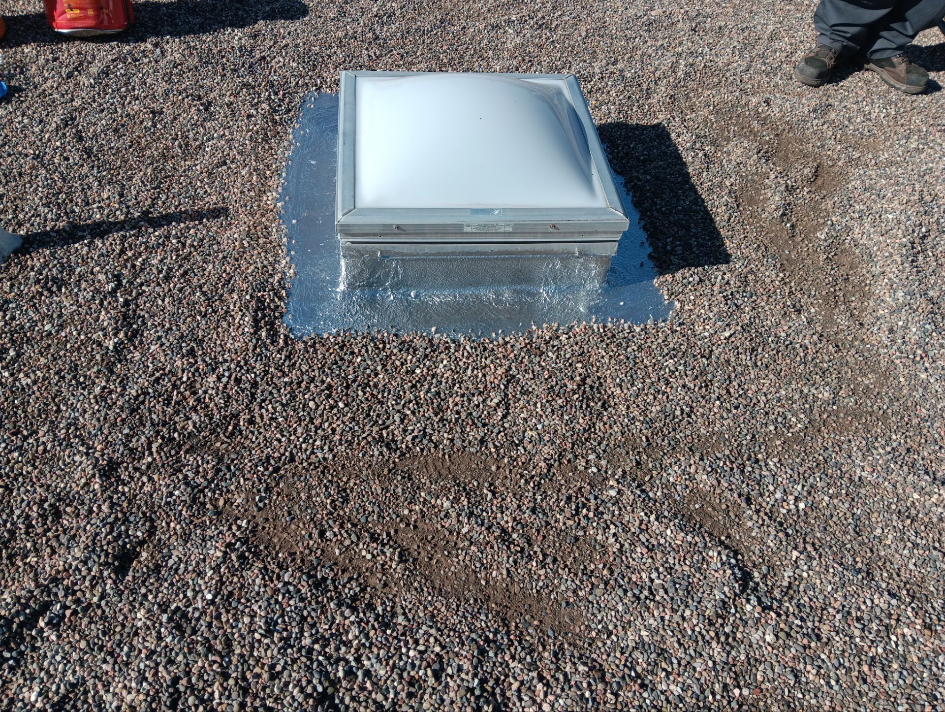 Roof Maintenance and Low-E Tempered Glass Skylight Replacement on Gravel Roof in Northwest Albuquerque by Doyle Roof Masters Inc