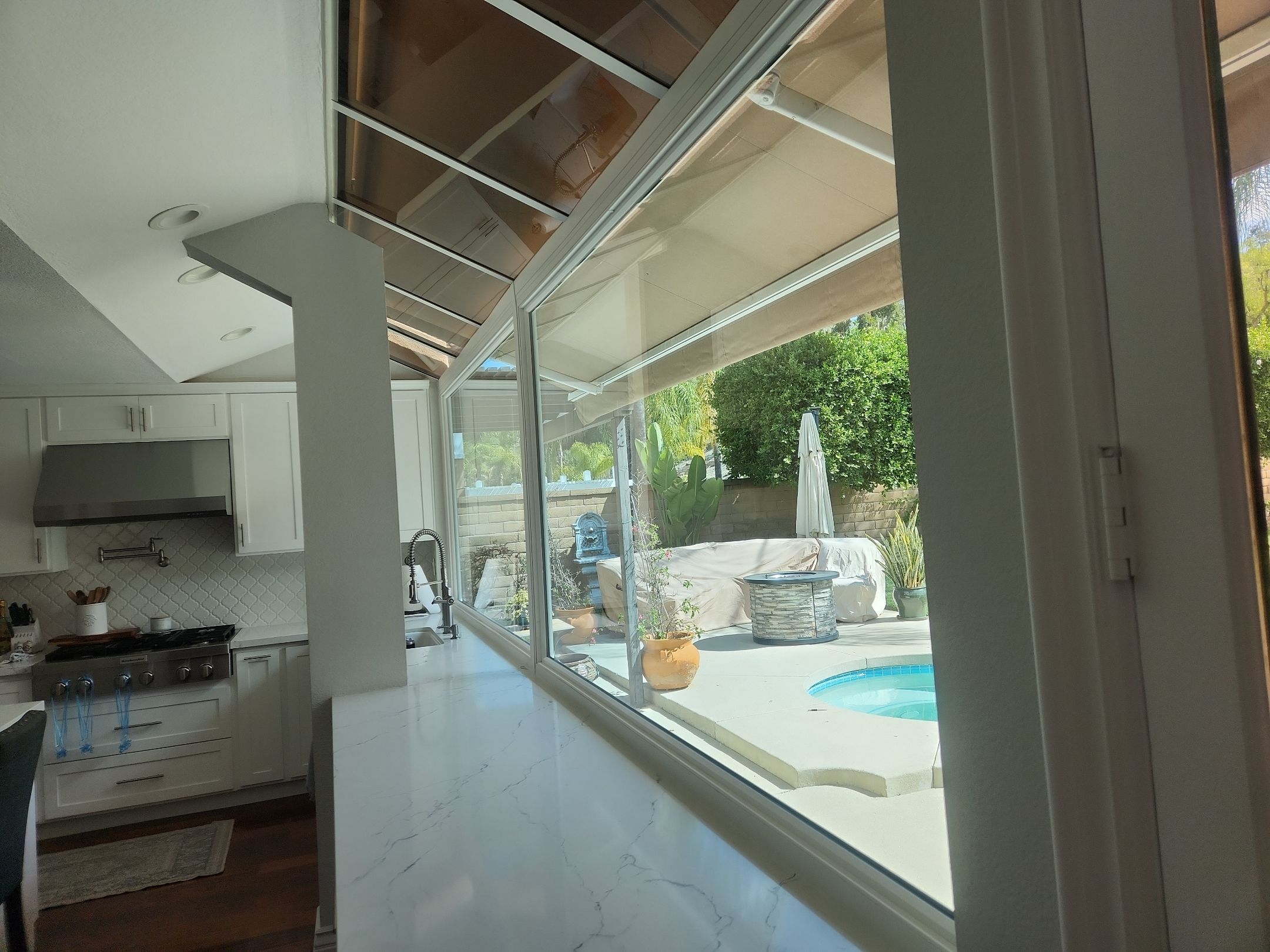 Window Installation using Anlin vinyl windows with Sunshield glass by American Window Company