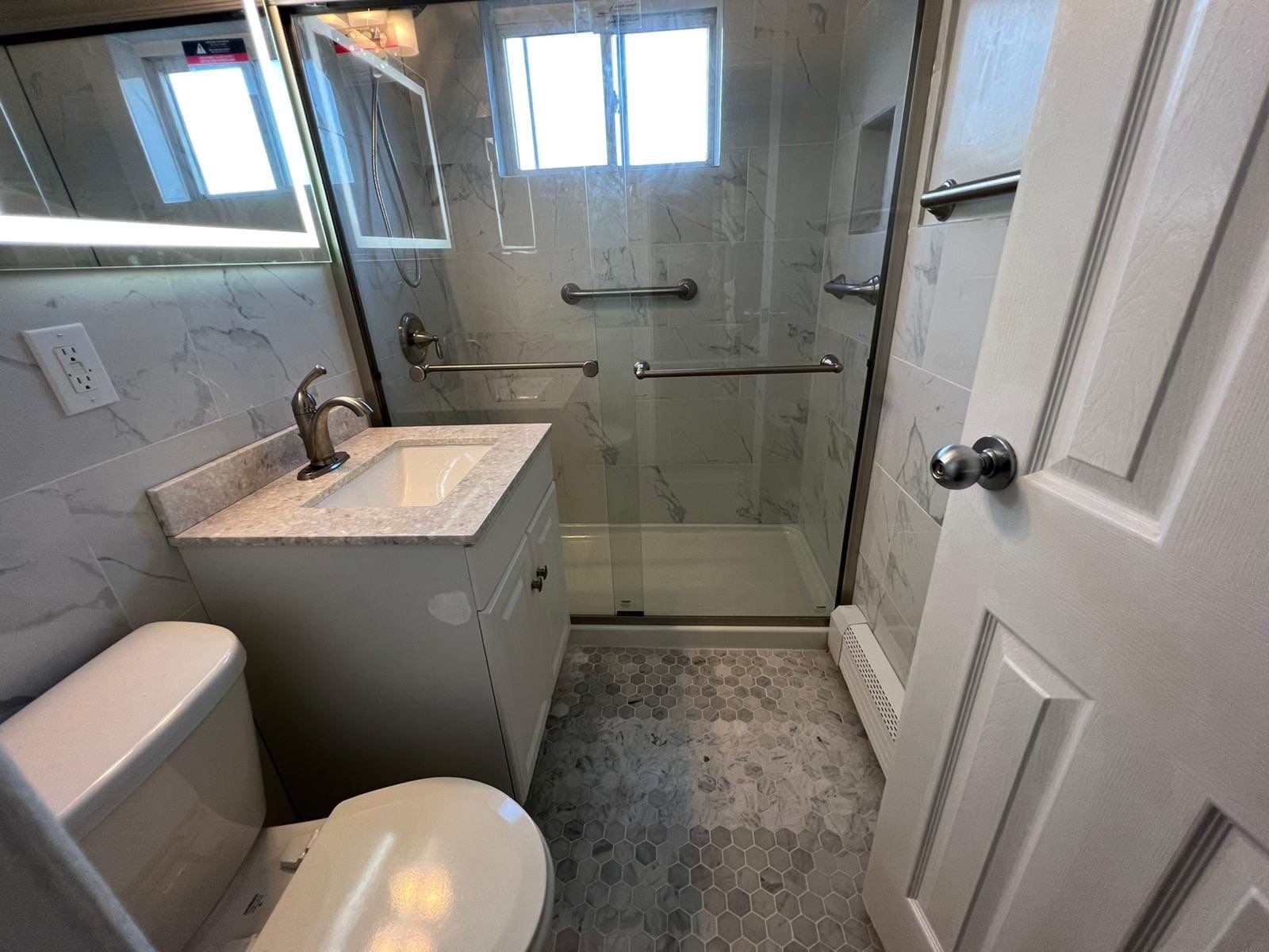 Bathroom Remodel using Tile by Home Concepts Construction