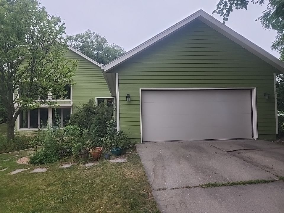 Complete house repaint to a different color  by Cutting edge painting 