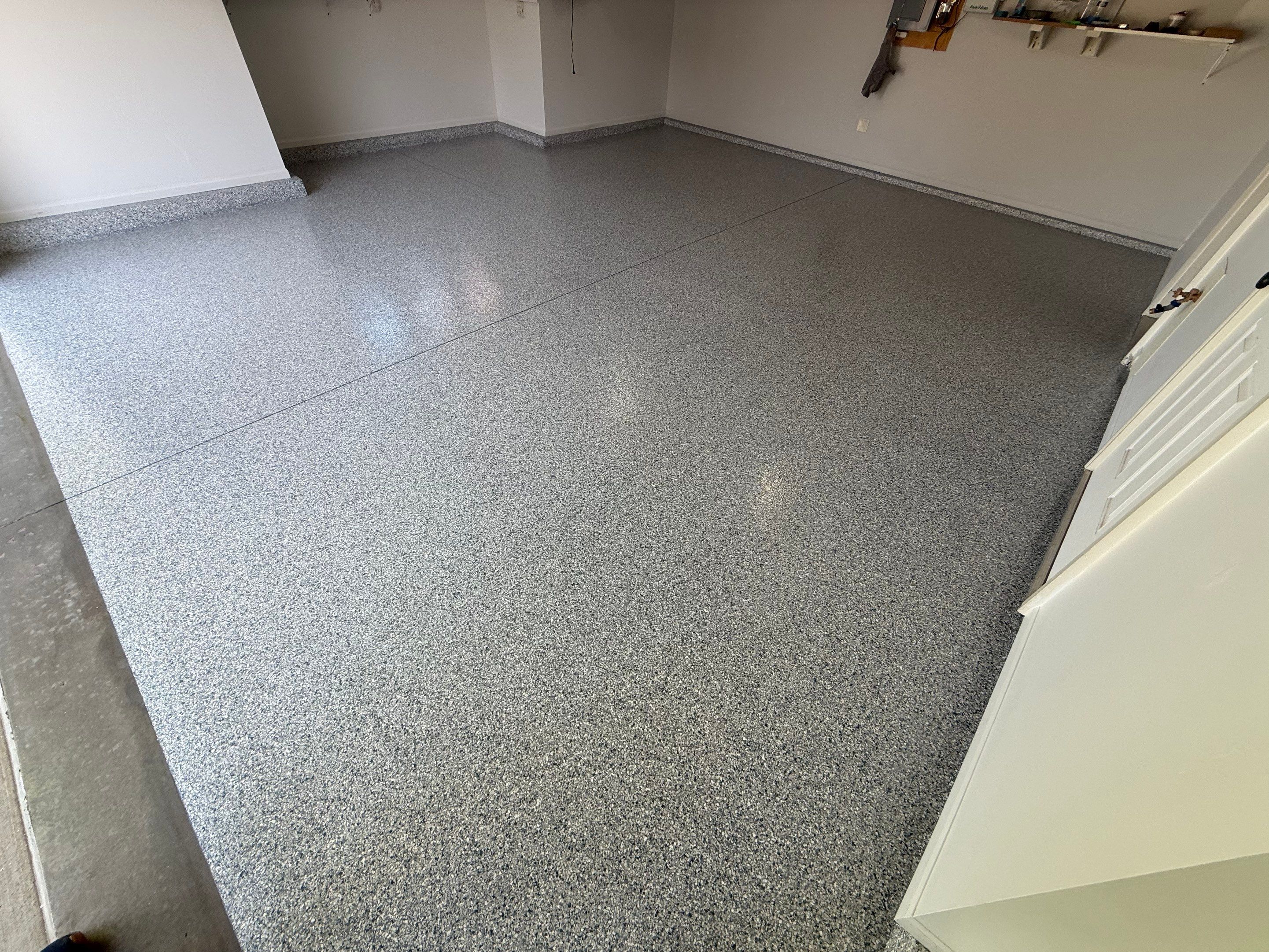 Decorative Chip Epoxy Floor Coating Installation in Sioux Falls by Select Painting, Coatings & Garage Cabinets