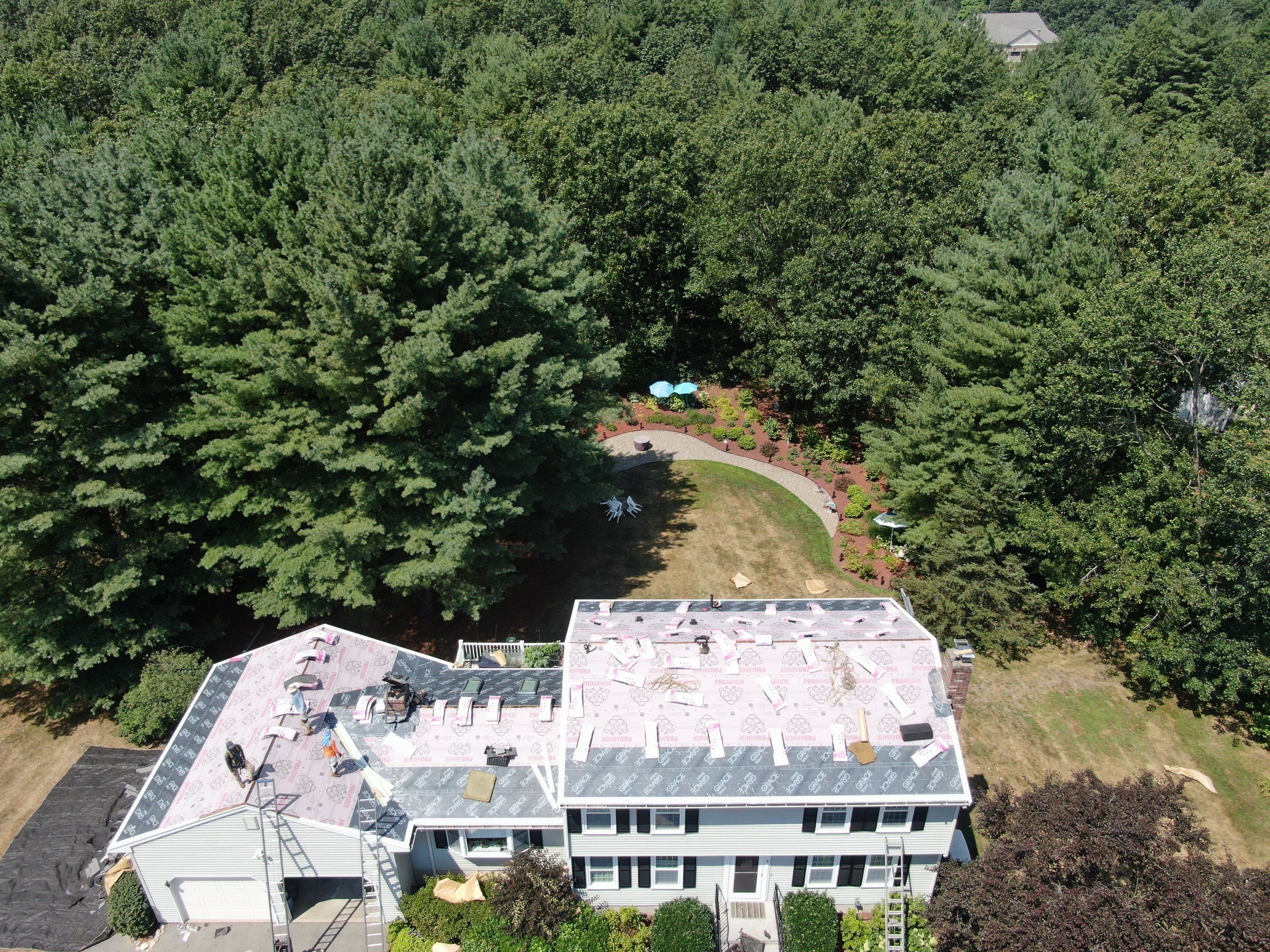 Complete Roof Replacement with Chimney Flashing, Gutter Guard System, and Vinyl Siding Repairs by Mighty Dog Roofing of Greater Middlesex County