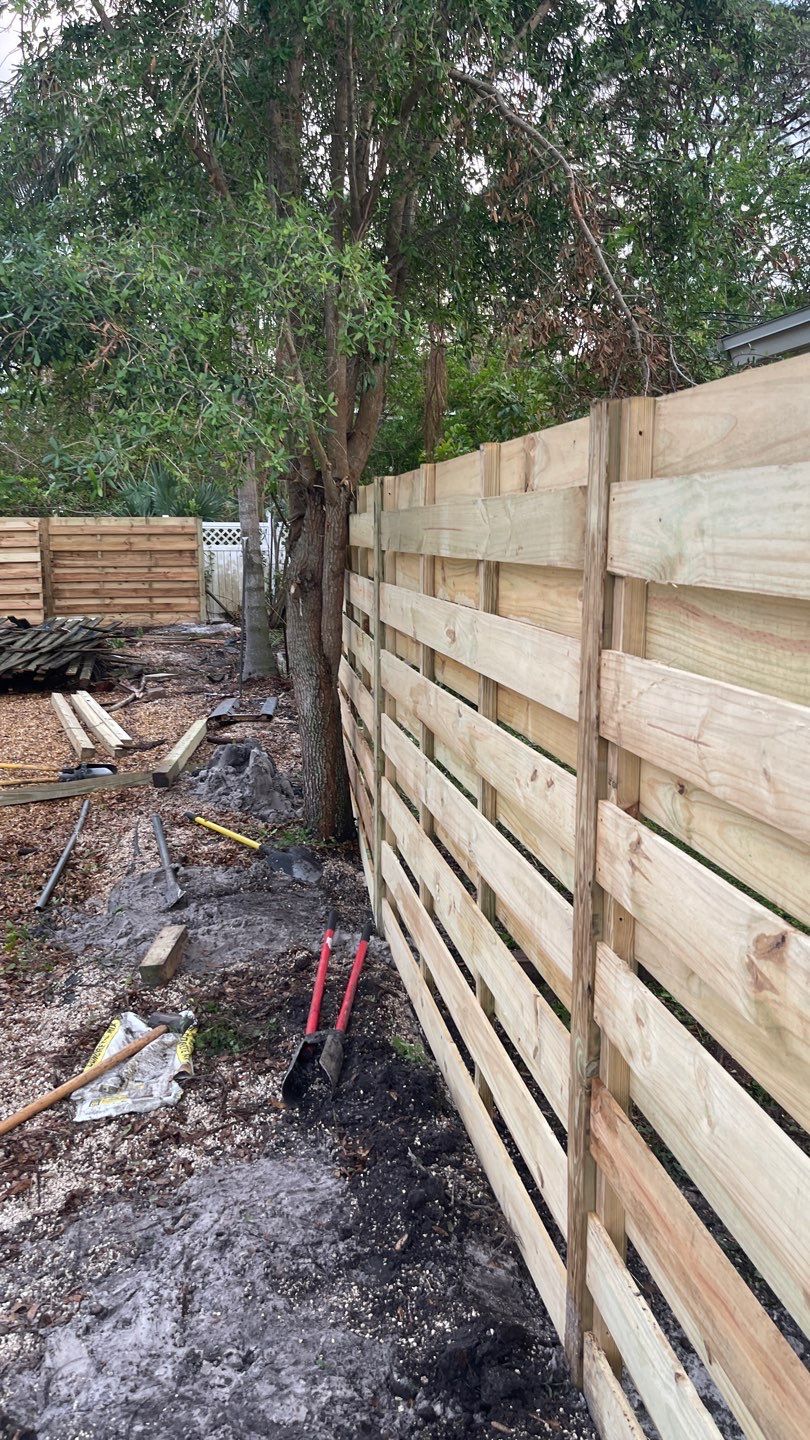 Wood Fence Installation using Horizontal Shadowbox Wood Privacy Fence by Asap fence and gates, LLC