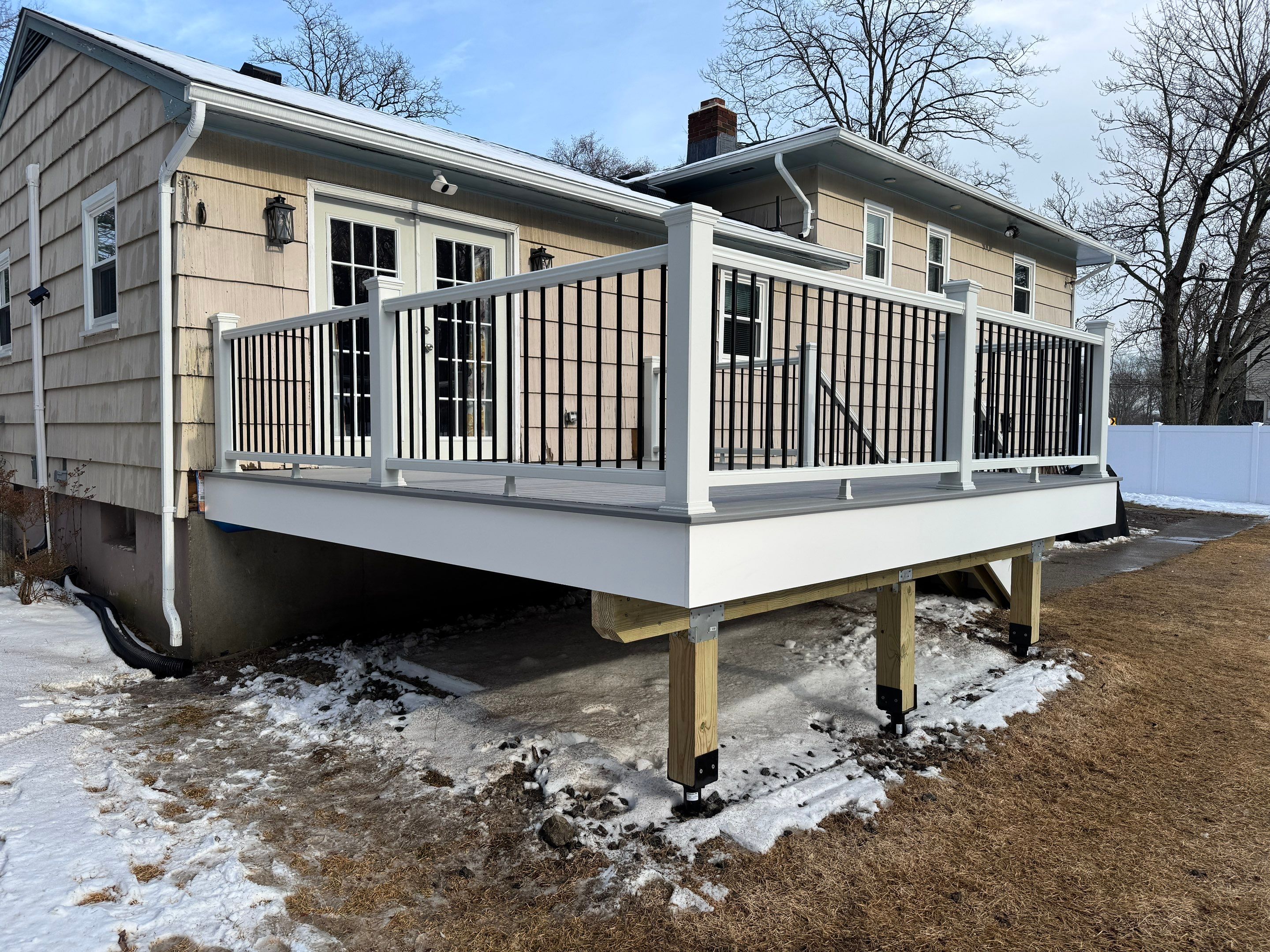 Deck replacement using Trex Lineage Rainier , and Transcend White railing.  by DiGiorgi Roofing and Siding Inc