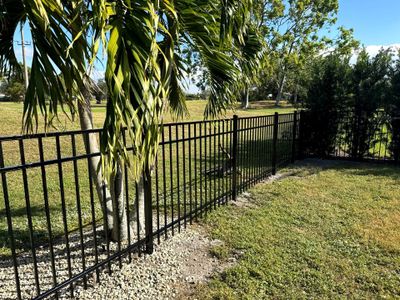 Aluminum Fence Installation using 3 Rail 4Ft Black Aluminum and 4Ft White Vinyl Fence