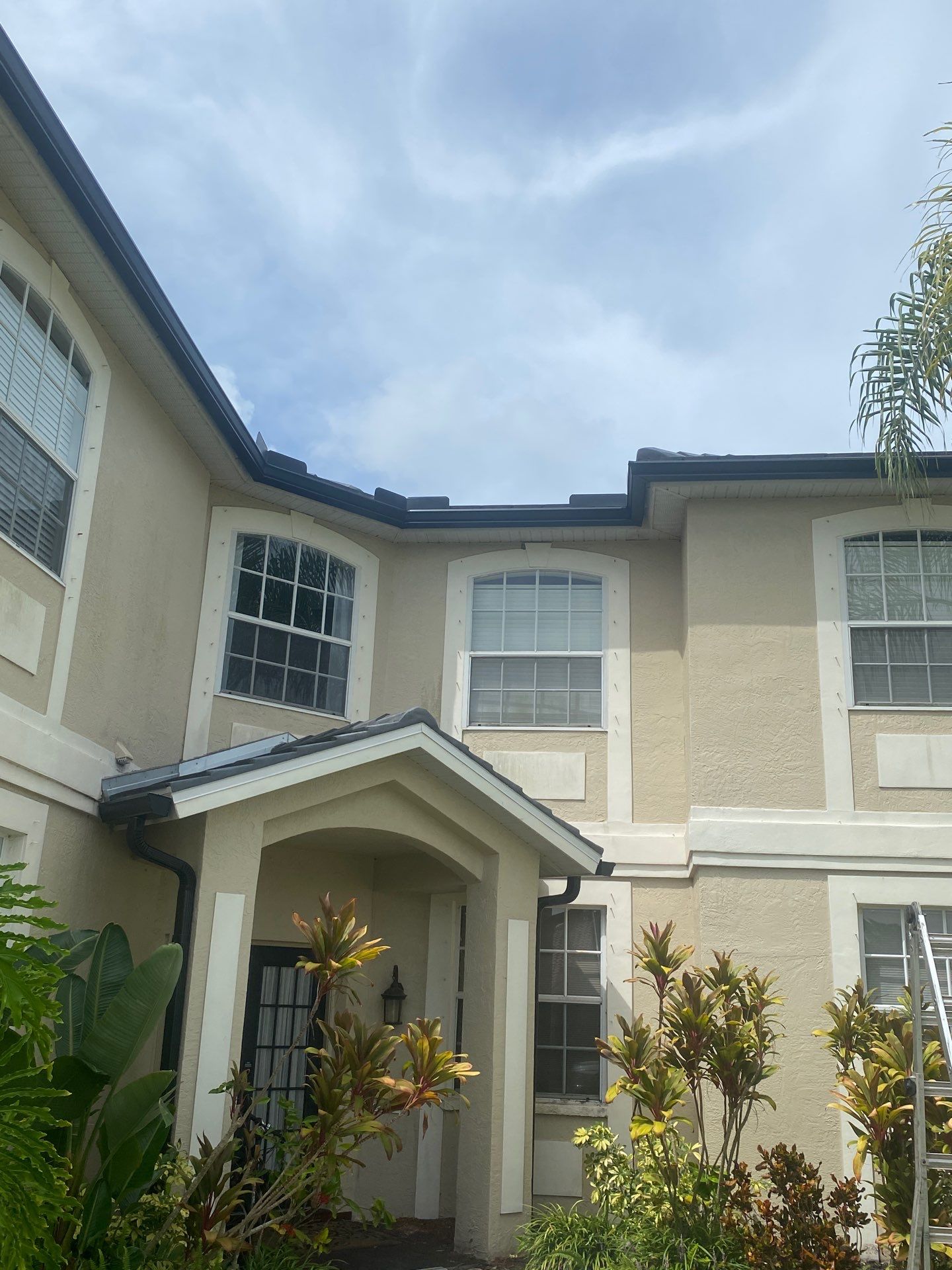 Black Seamless Gutters for Modern Homes in Osprey FL by Gutter Professors