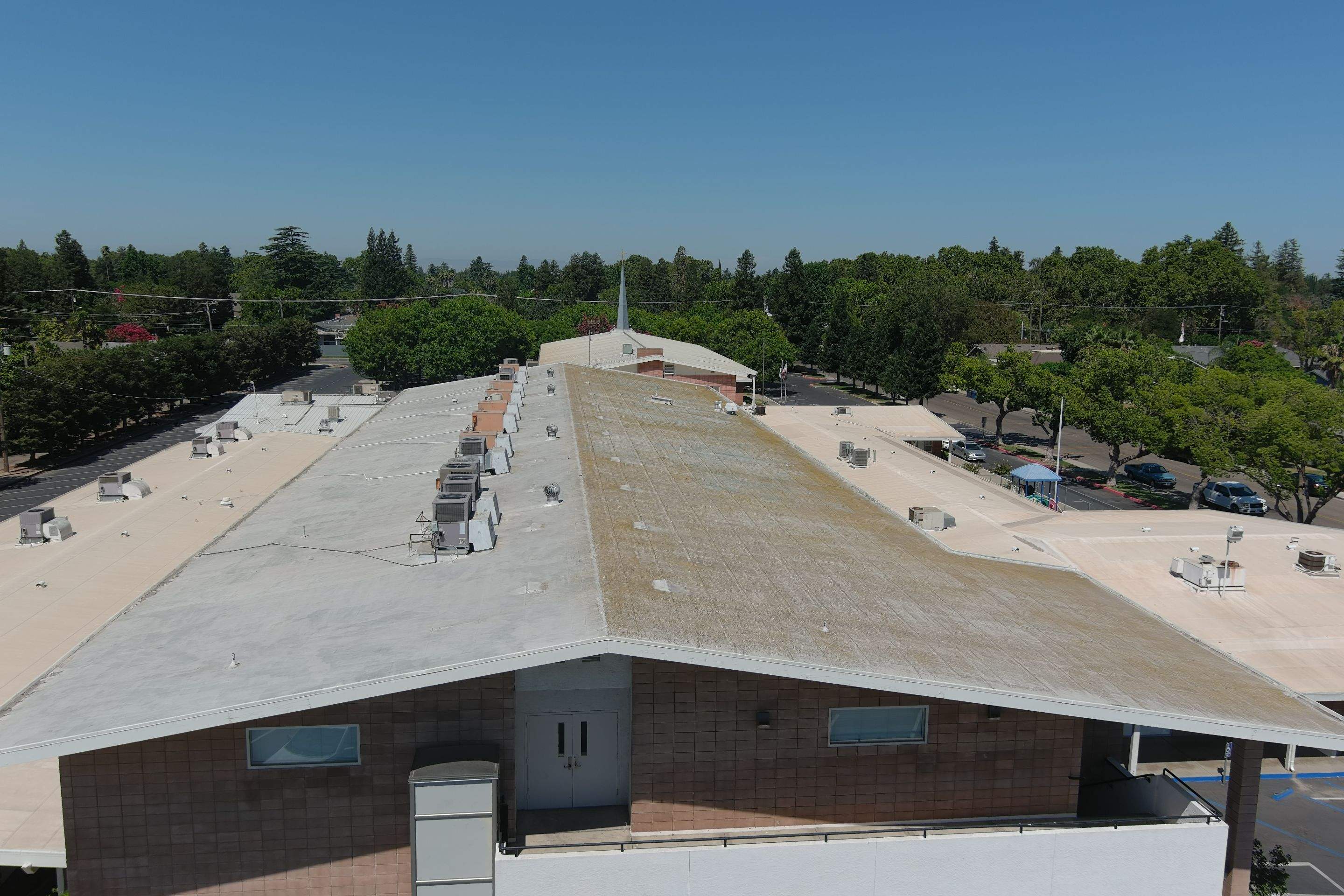 MR Roofing system using Benchmark/PUMA XL coatings over TPO single-ply roofing by Straight Edge Roofing Inc