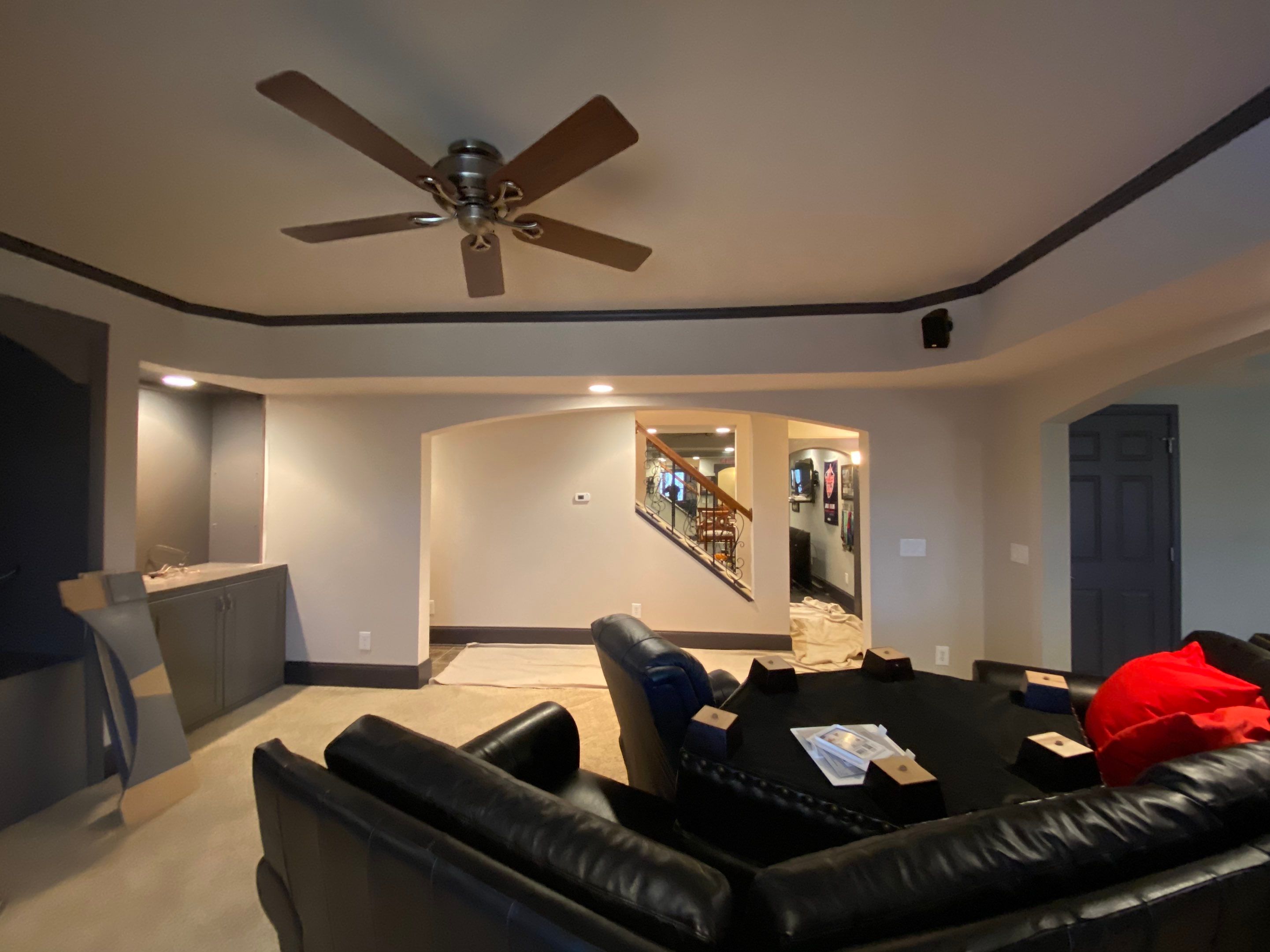 Finished Basement Renovation with Custom Shiplap and Modernized Wood Railings by Swift Home Renovations 