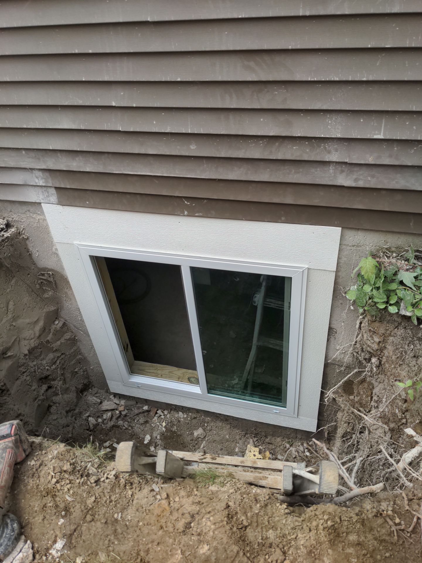 Interior Basement Waterproofing System and Egress Window Installation by Toledo Basement Repair 