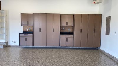 Kenny & Debbie transformed their garage with a Banner Garage Floor and cabinets
