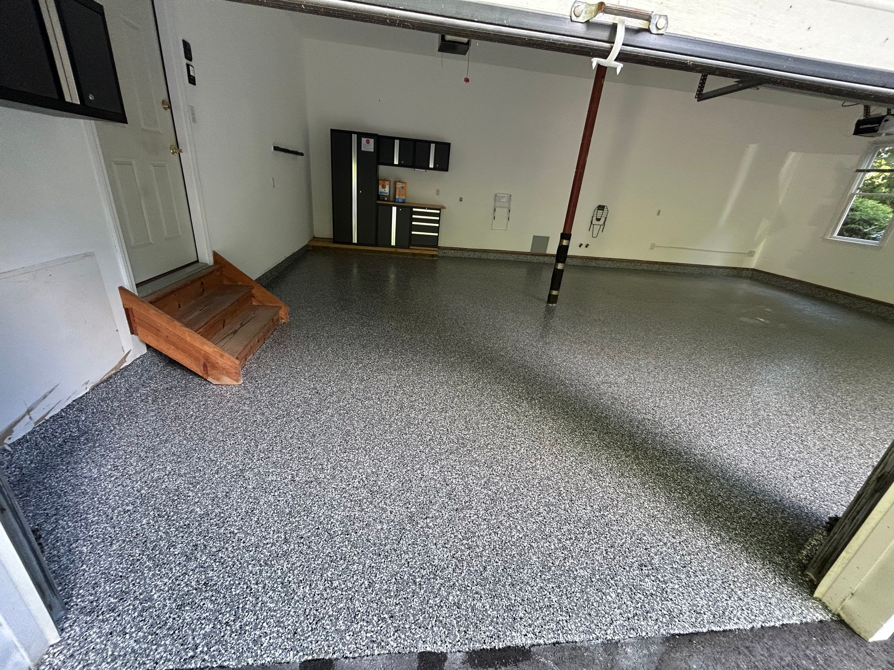 Wombat Concrete Floor Coating Transformation by DiGiorgi Roofing and Siding Inc