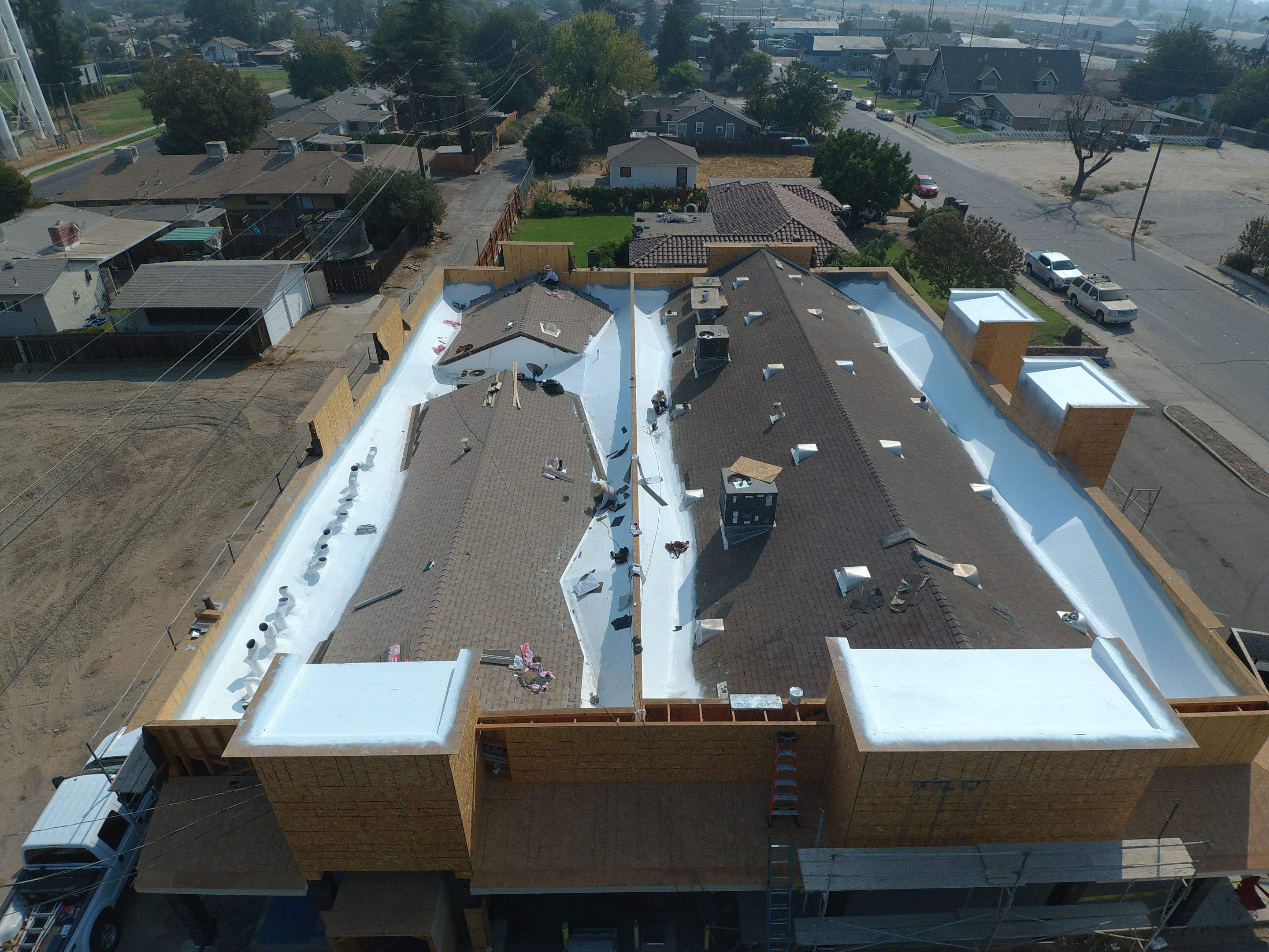 Spray foam and coatings using Conklin Benchmark/PUMA XL coatings and spray foam by Straight Edge Roofing Inc
