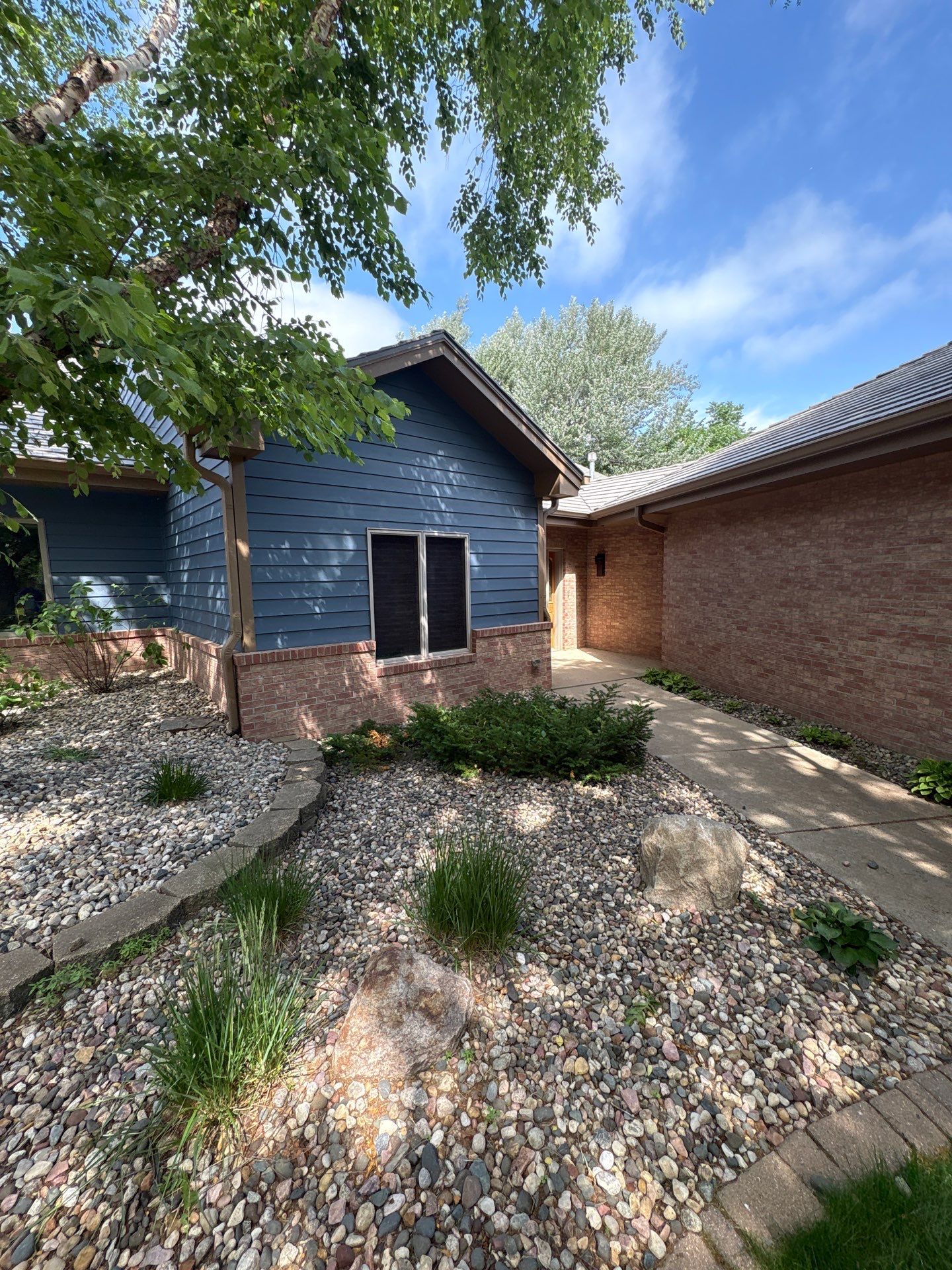 Residential Exterior Painting and Siding Refresh in Sioux Falls by Select Painting, Coatings & Garage Cabinets