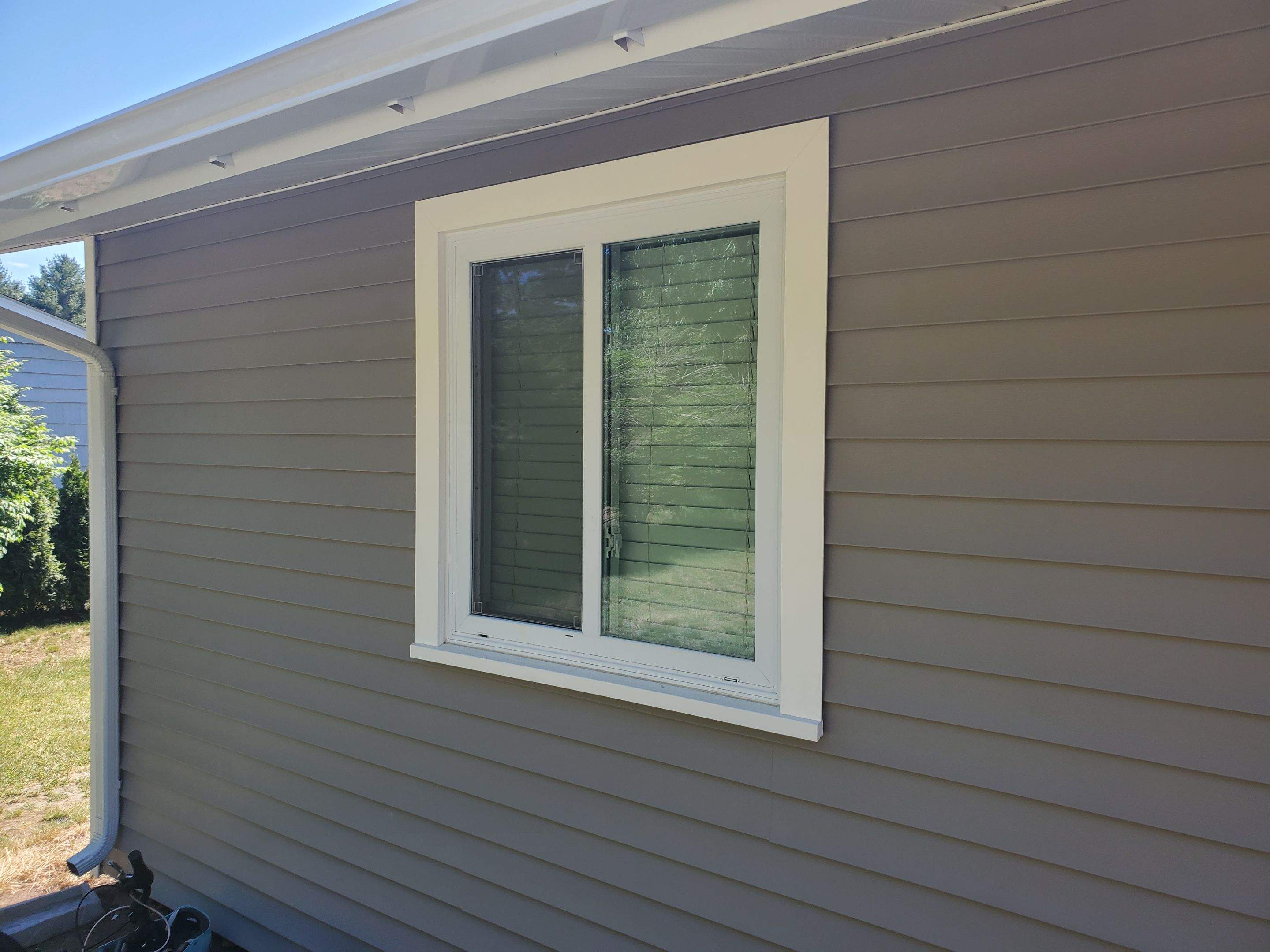 Siding Installation using insulation, PVC trim and vinyl siding by UBrothers Construction