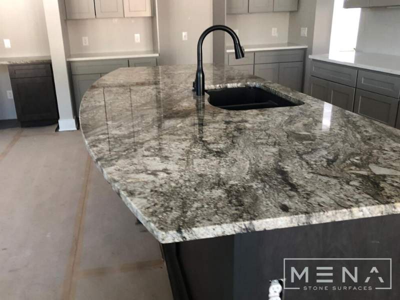 Kitchen countertops using Blue Dunes Granite by Mena stone surfaces