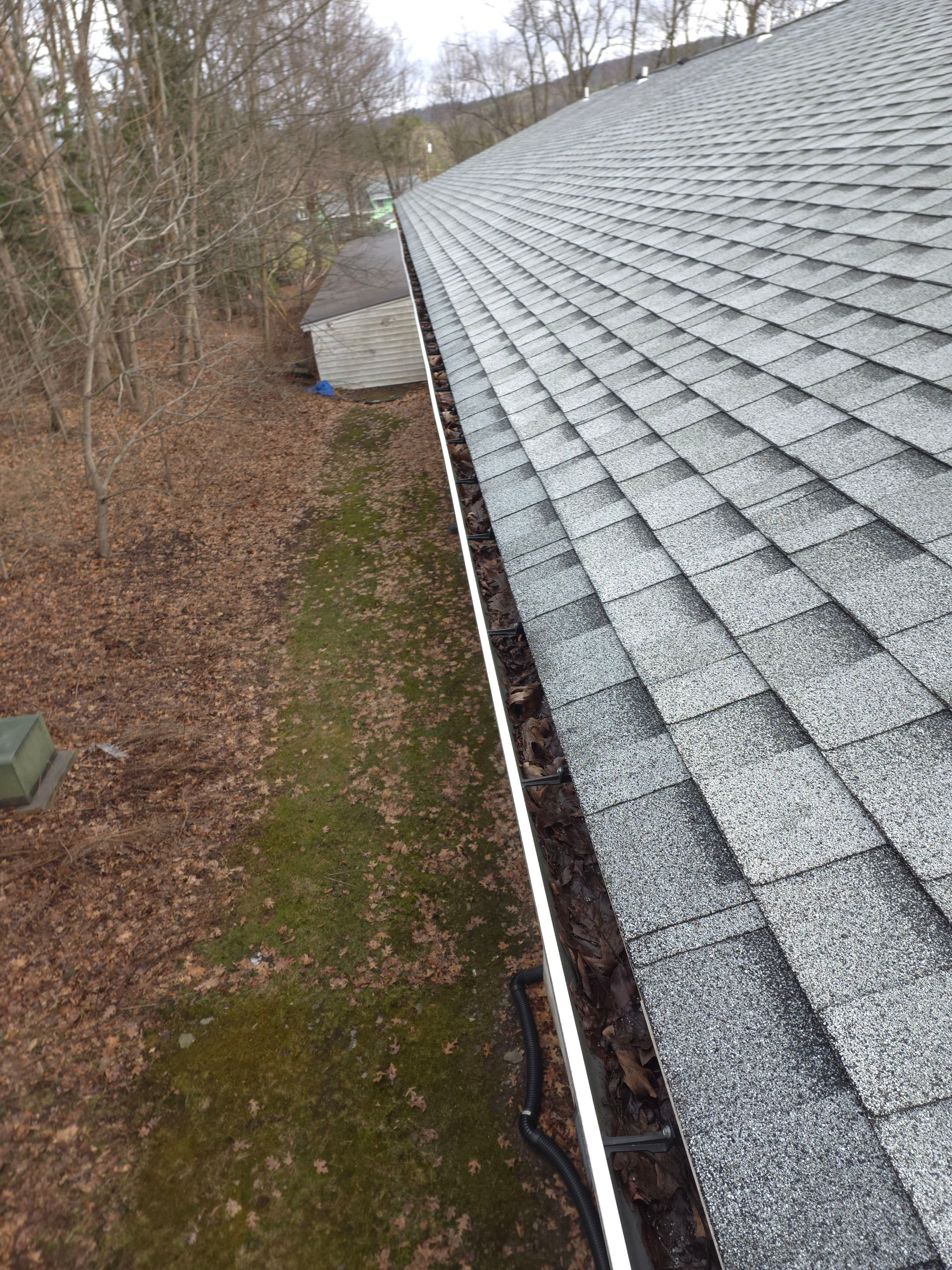 Commercial gutter cleaning Syracuse before photo with filled gutters