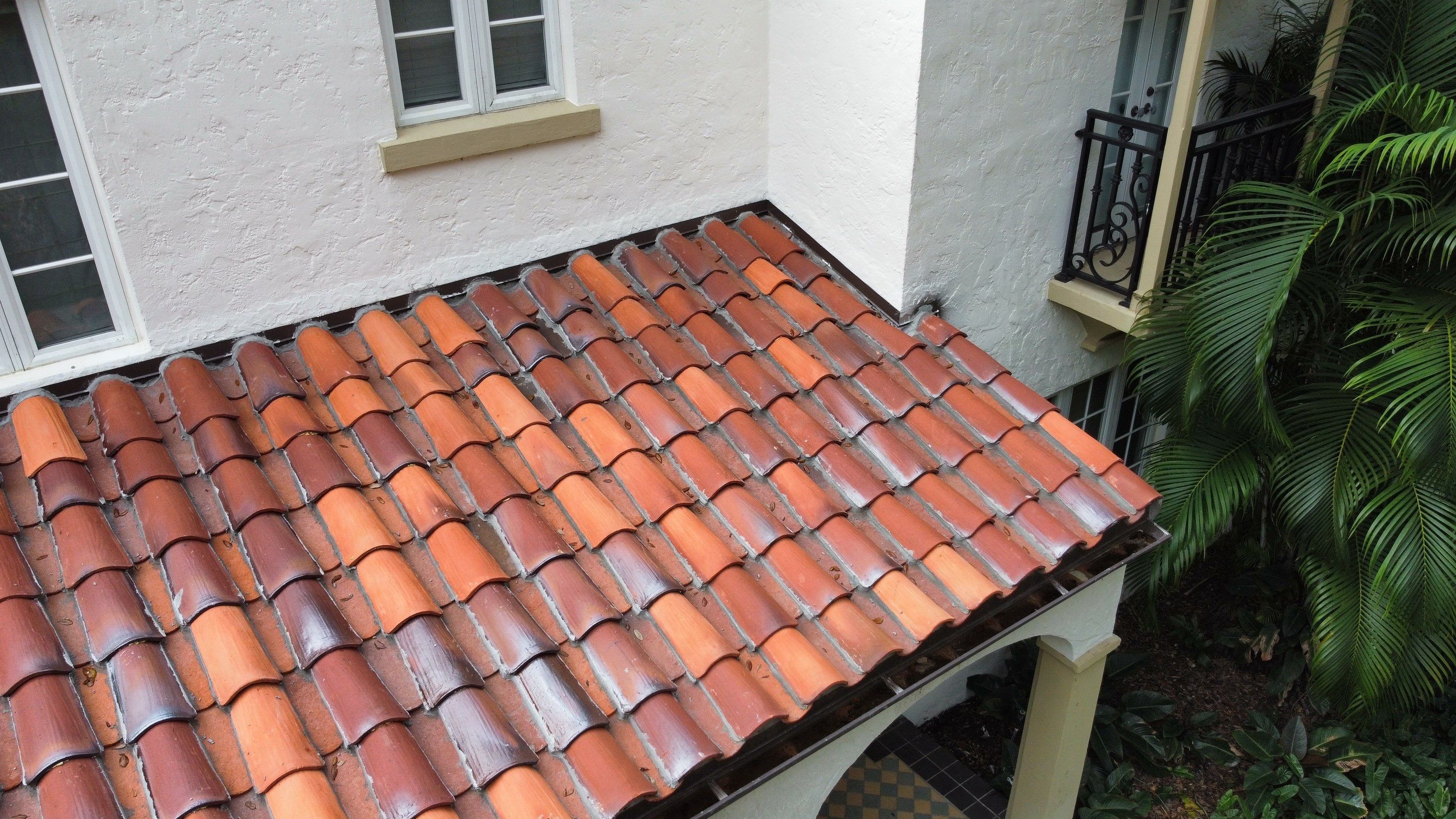 Residential Roofing Installation using Two Piece Clay Barrel Tile with a mortar set application by BOB HILSON & CO INC