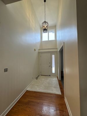 Residential Interior Wall Repaint | Foyer, Stairwell, Hallway & Living Room